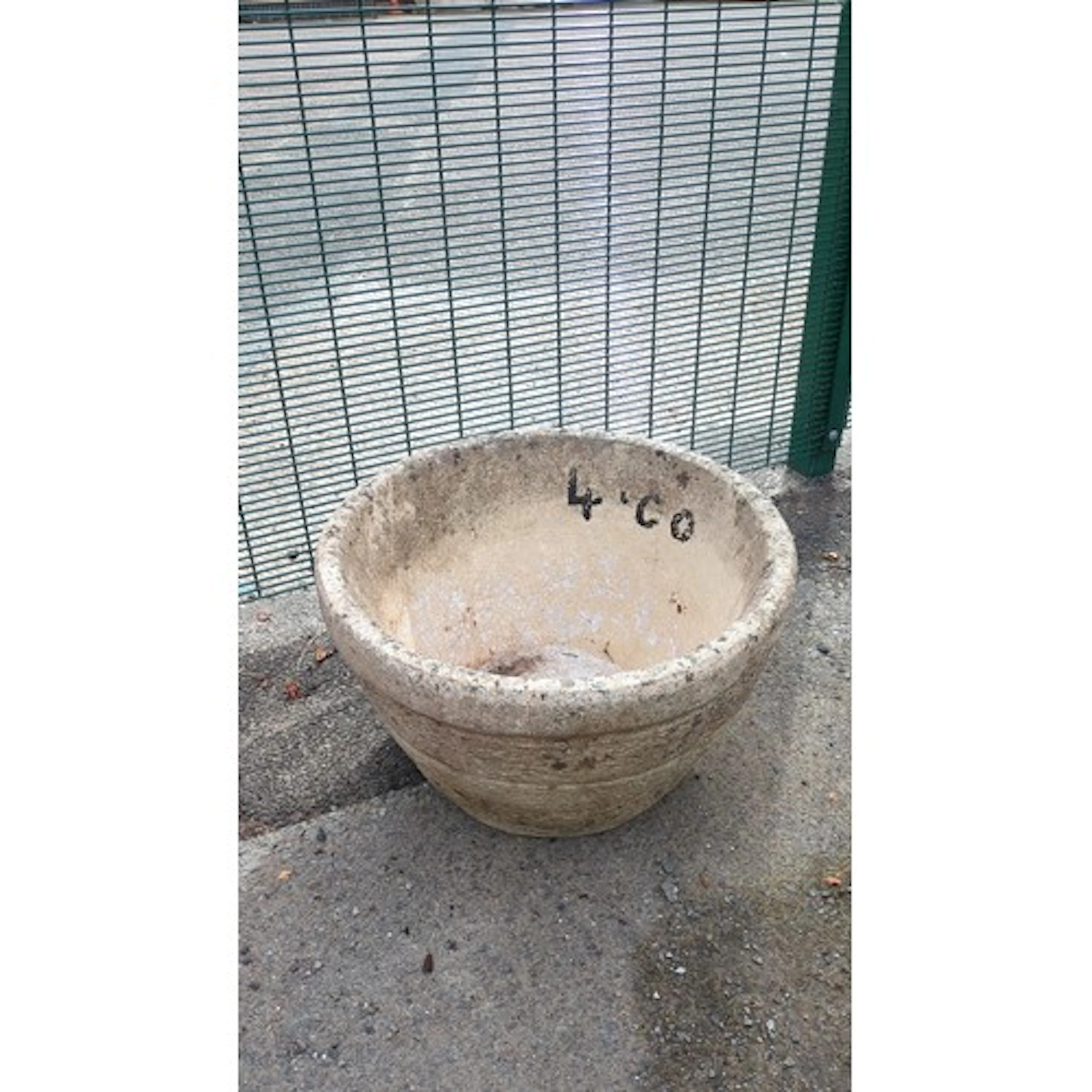 Large cast composite stone garden planter of tapering circul...