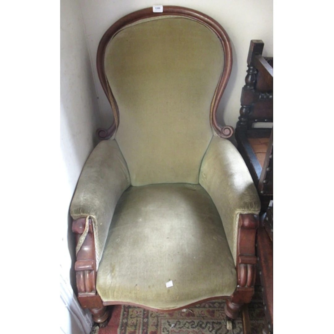 Victorian mahogany and upholstered spoonback armchair on tur...