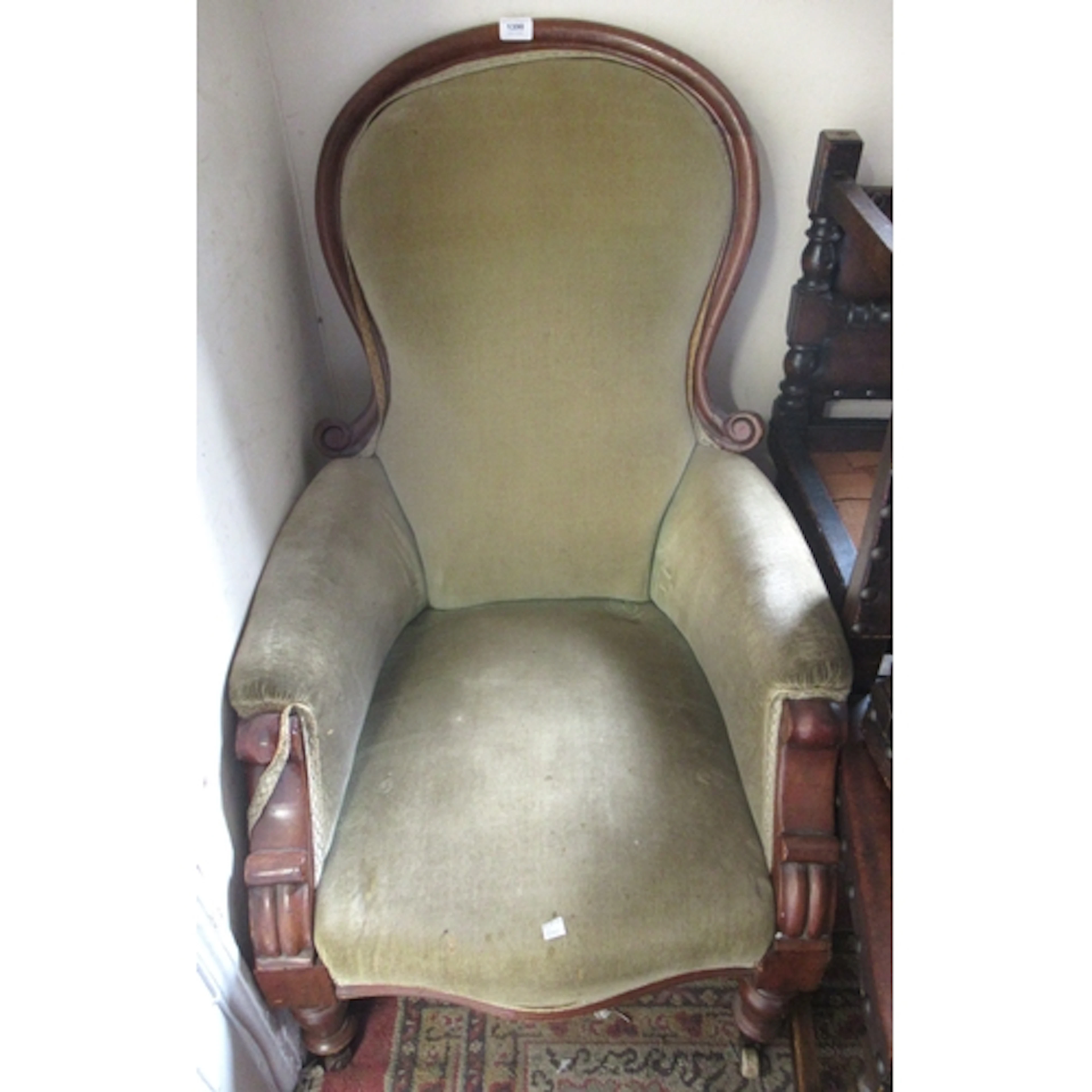 Victorian mahogany and upholstered spoonback armchair on tur...