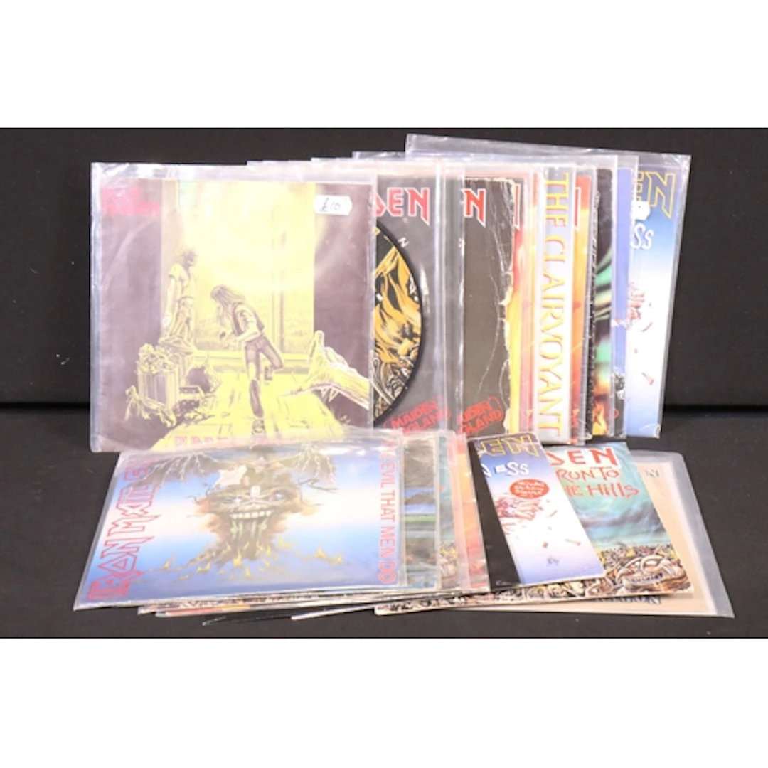 Vinyl - 20 Iron Maiden 7" singles and 1 Bruce Dickison spann...