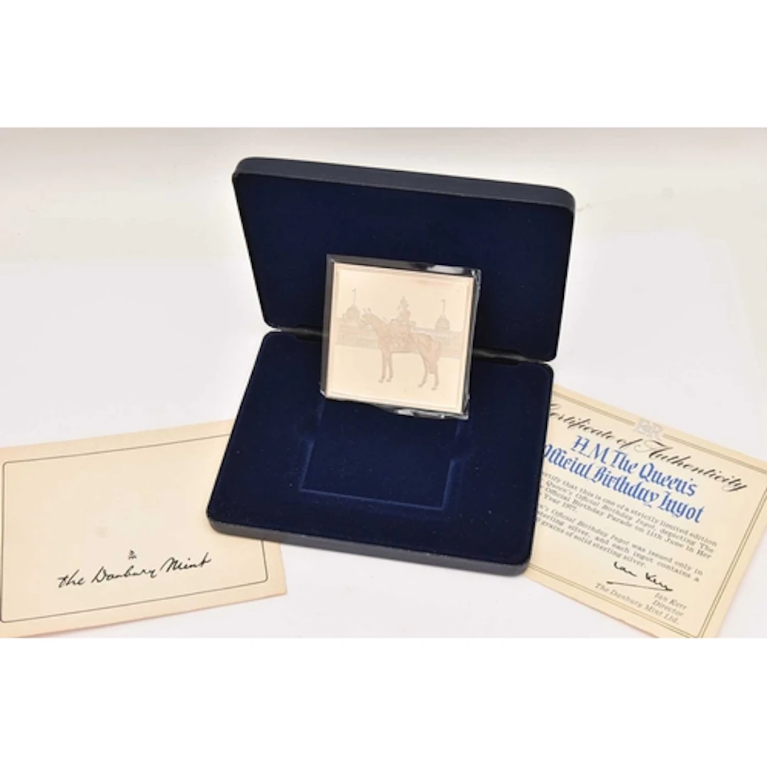 A CASED 'DANBURY MINT' H.M.THE QUEENS OFFICIAL BIRTHDAY INGO...