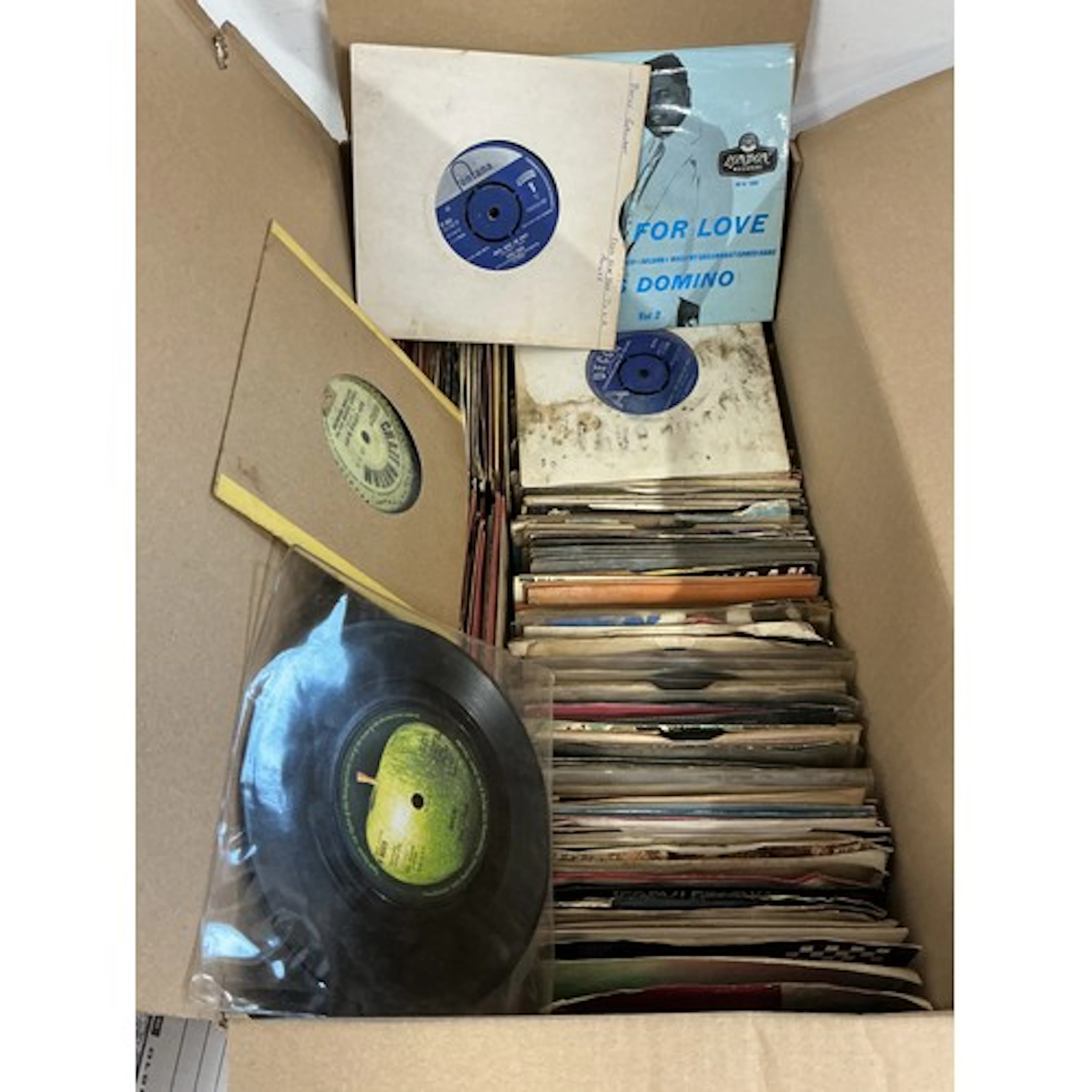 Three boxes of 7” singles and EPs by various artists. Includ...