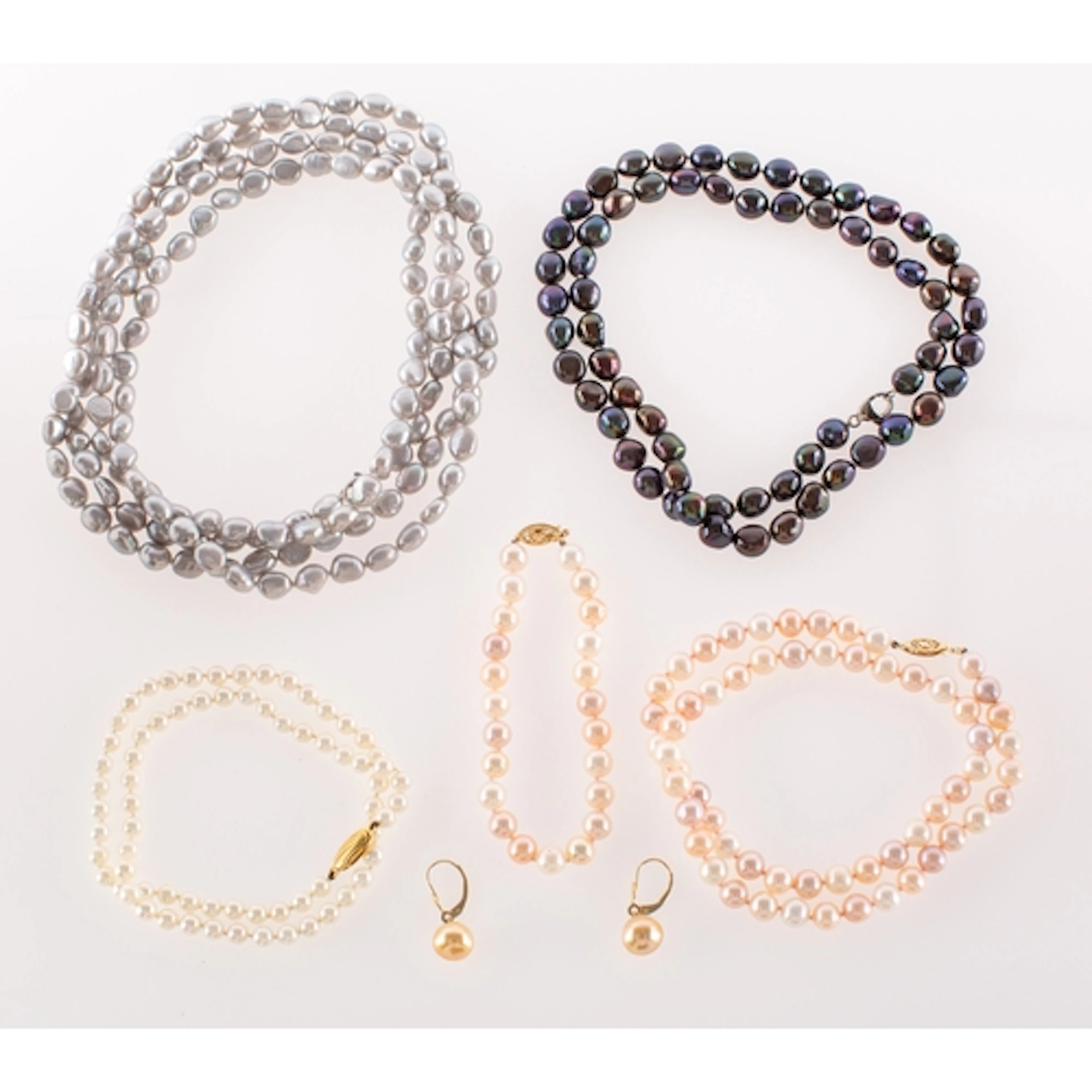A mixed collection of pearl necklaces and a pair of earrings...