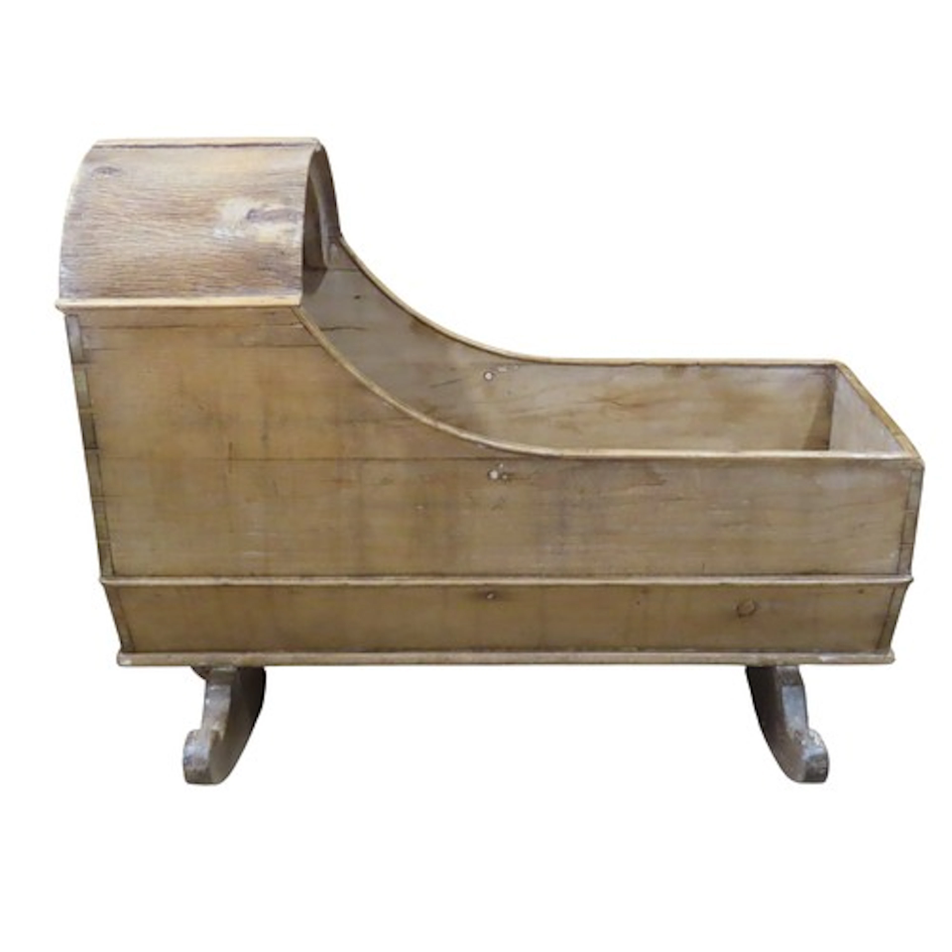 An antique stripped pine cradle with shaped hood and rockers...