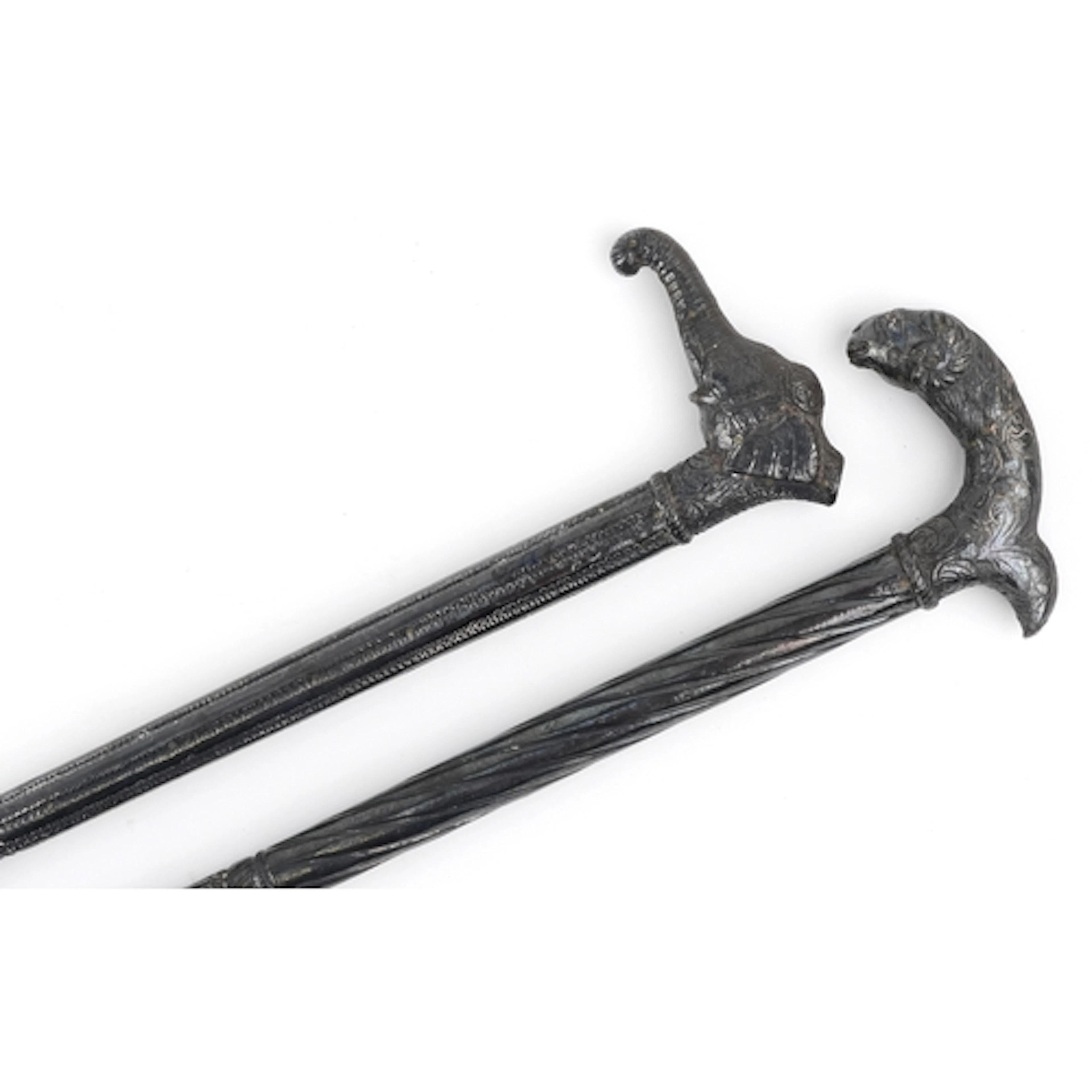 Two vintage Middle Eastern walking sticks with white metal o...