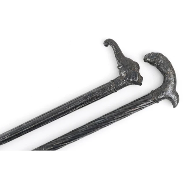 Two vintage Middle Eastern walking sticks with white metal o...