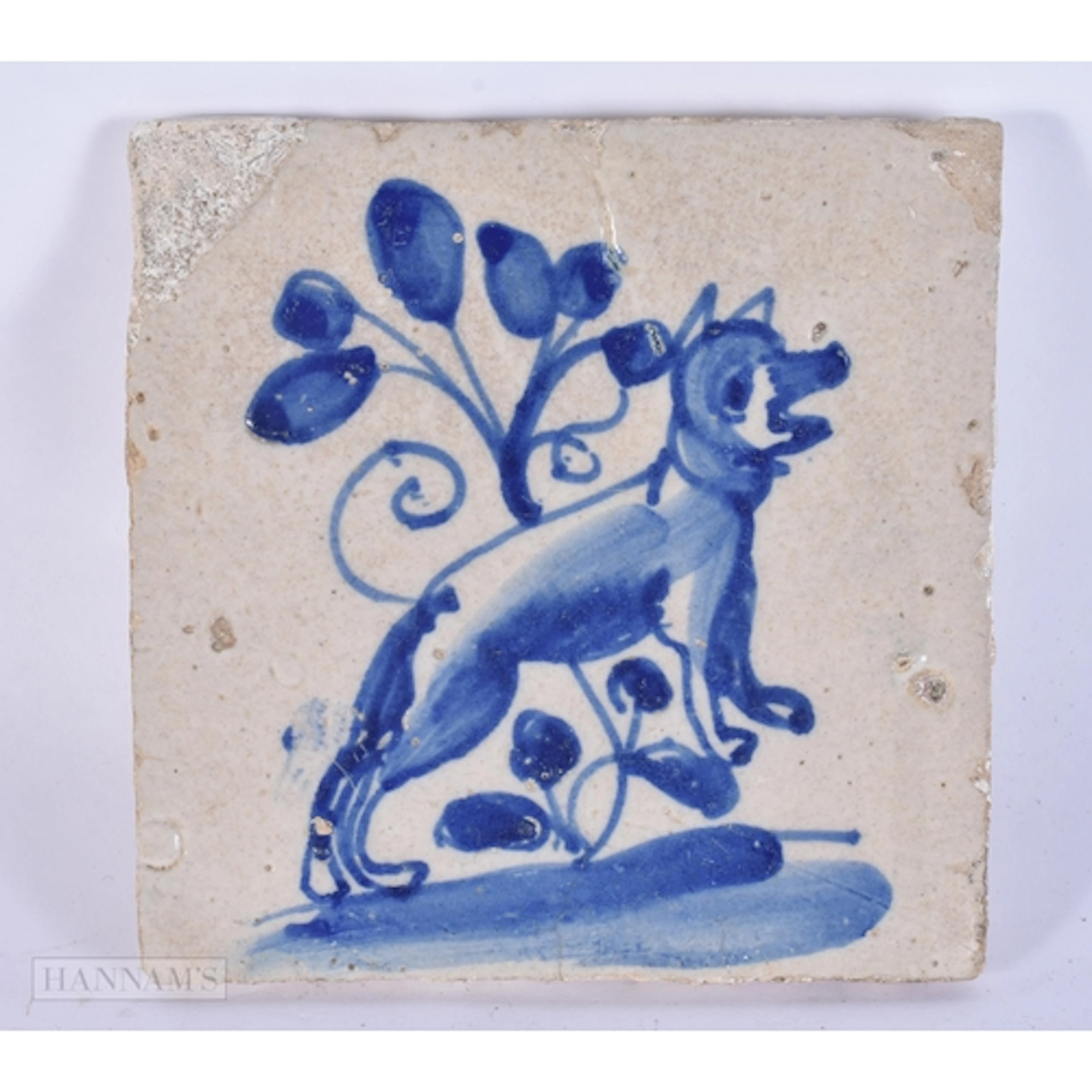AN EARLY DELFT BLUE AND WHITE POTTERY TILE painted with a le...