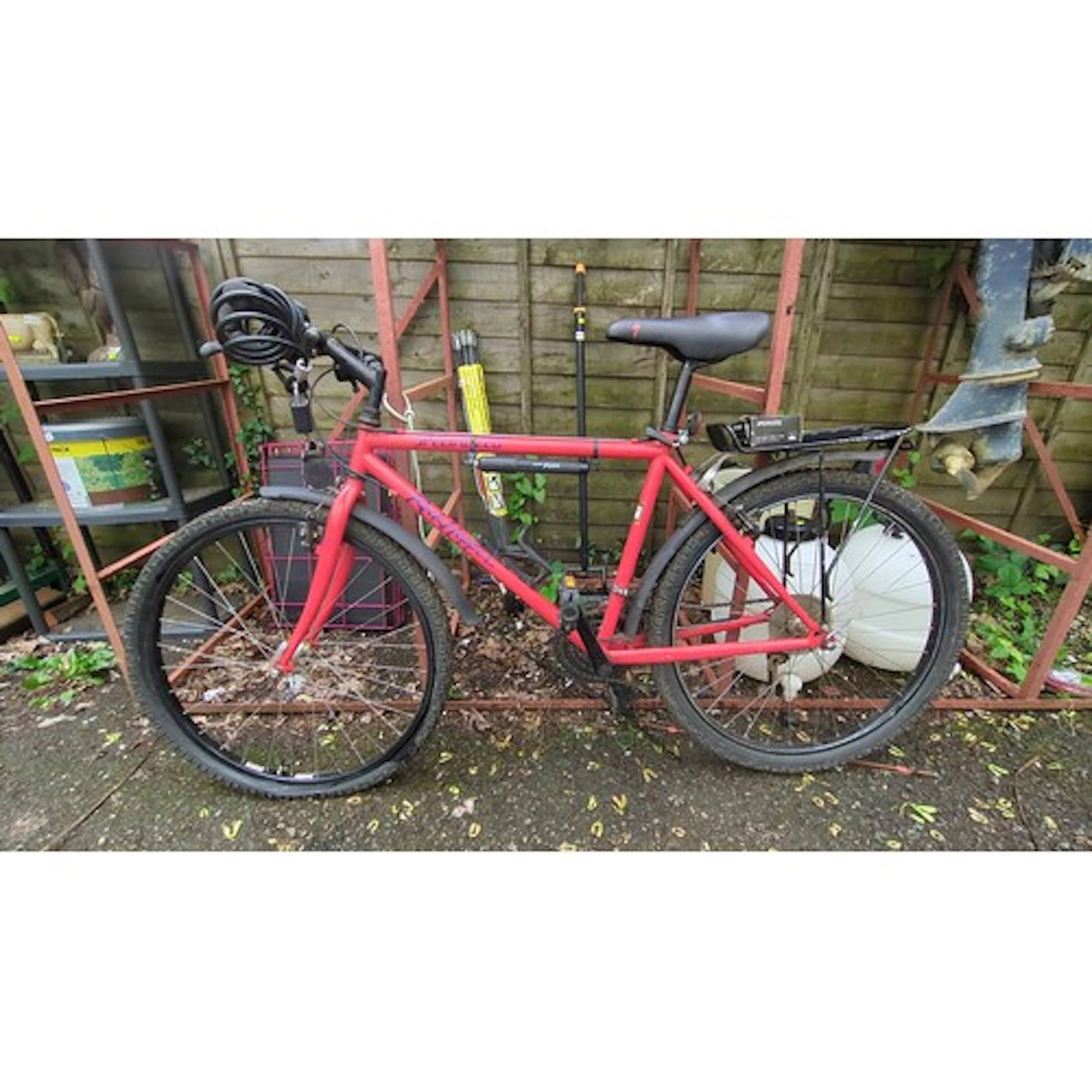 Specialized rigid-frame mountain bicycle with red frame, fla...