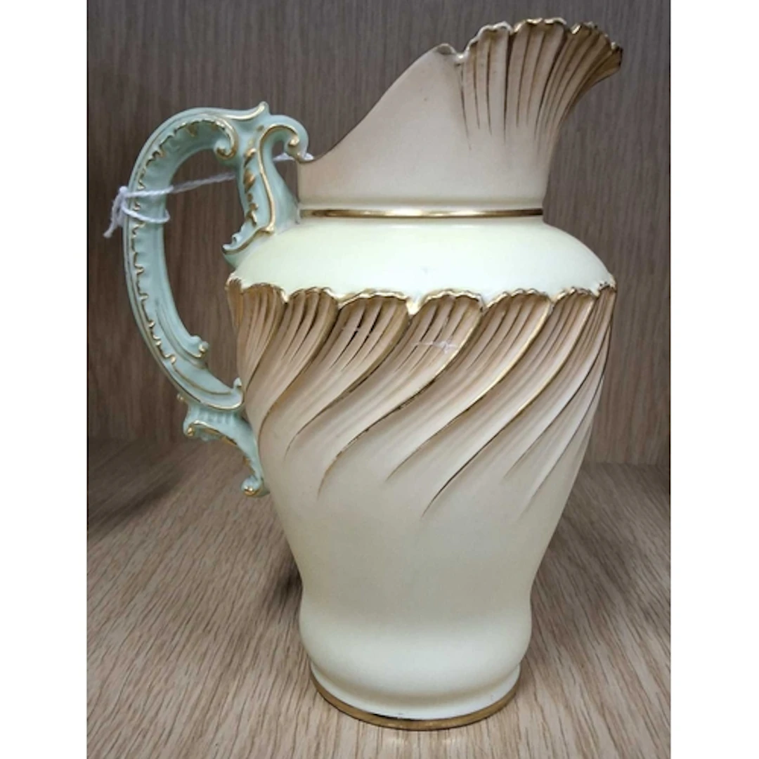 A ROYAL WORCESTER BLUSH IVORY JUG, shape no. 1652, its shoul...