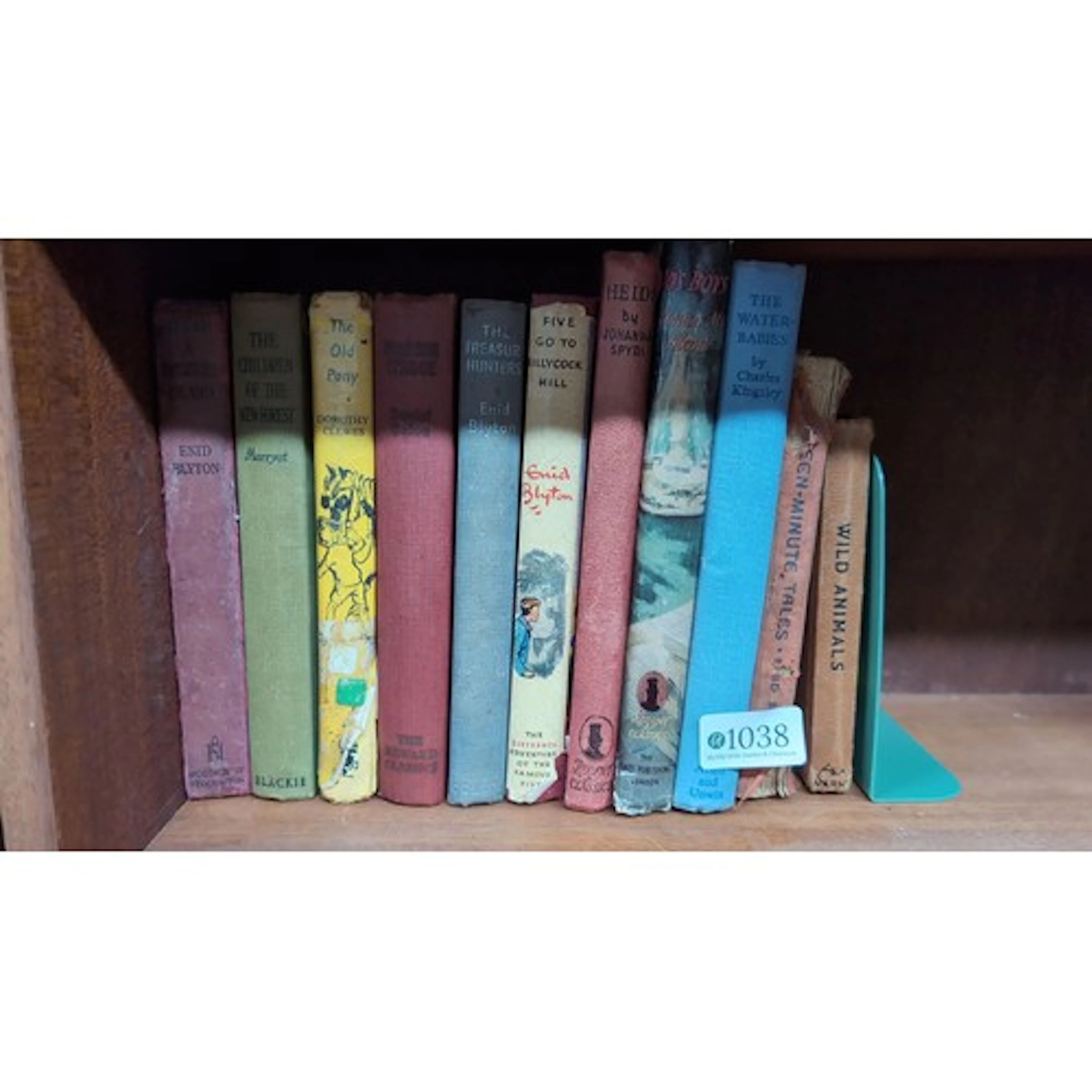 A group of vintage cloth-bound books, chiefly children’s and...