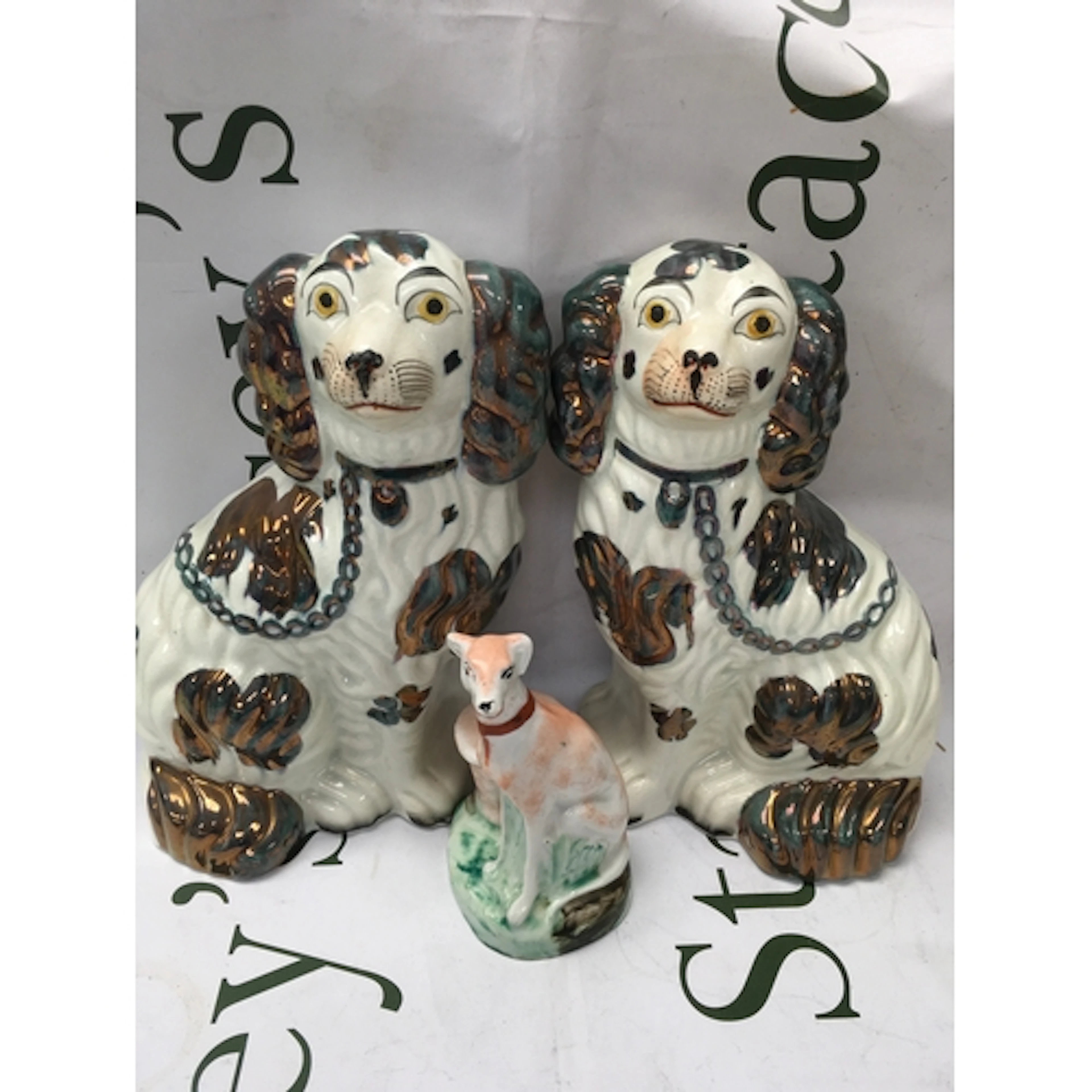A pair of Staffordshire dogs and a ceramic dog ink wall.&nbs...