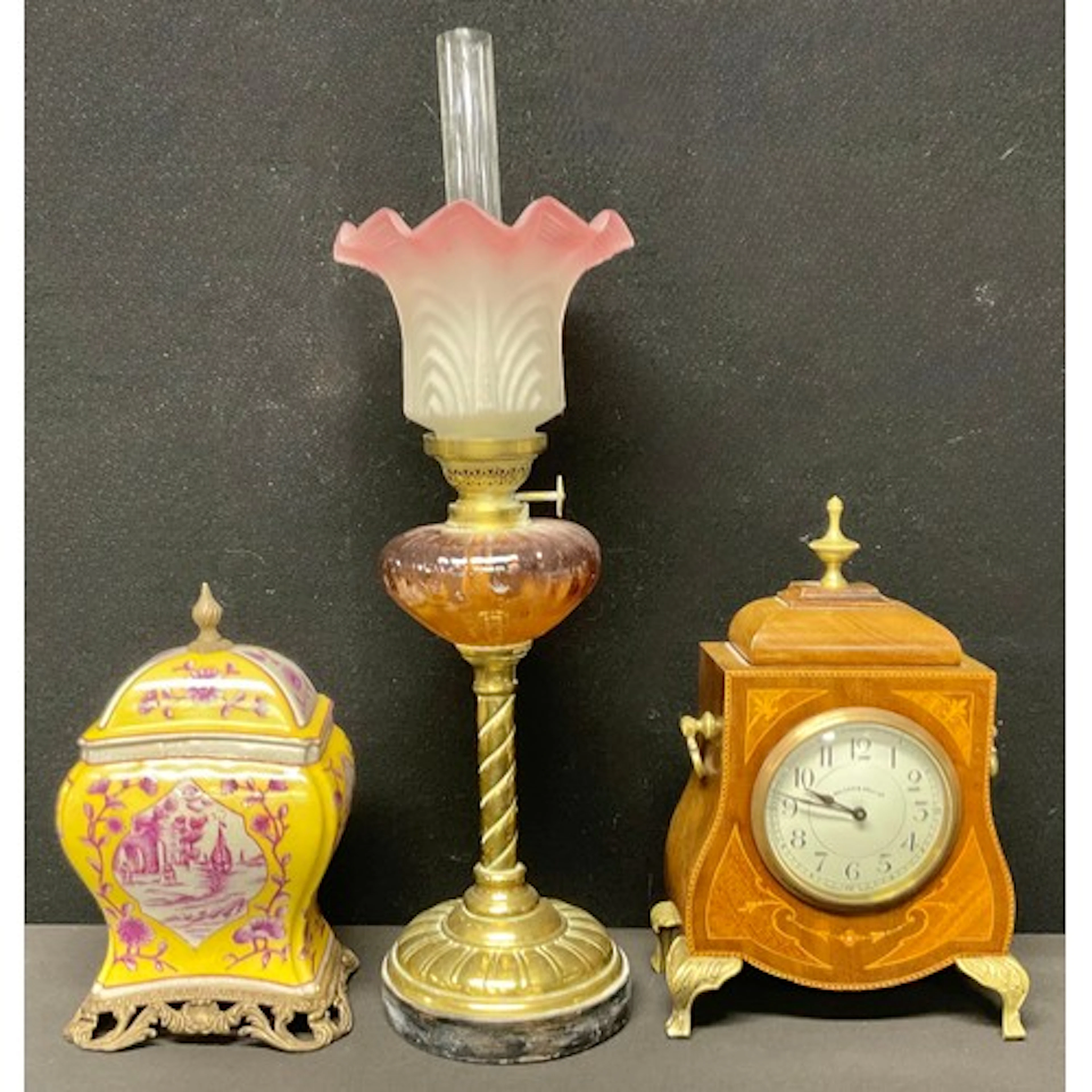 An early 20th mahogany inlaid mantel clock, the circular dia...