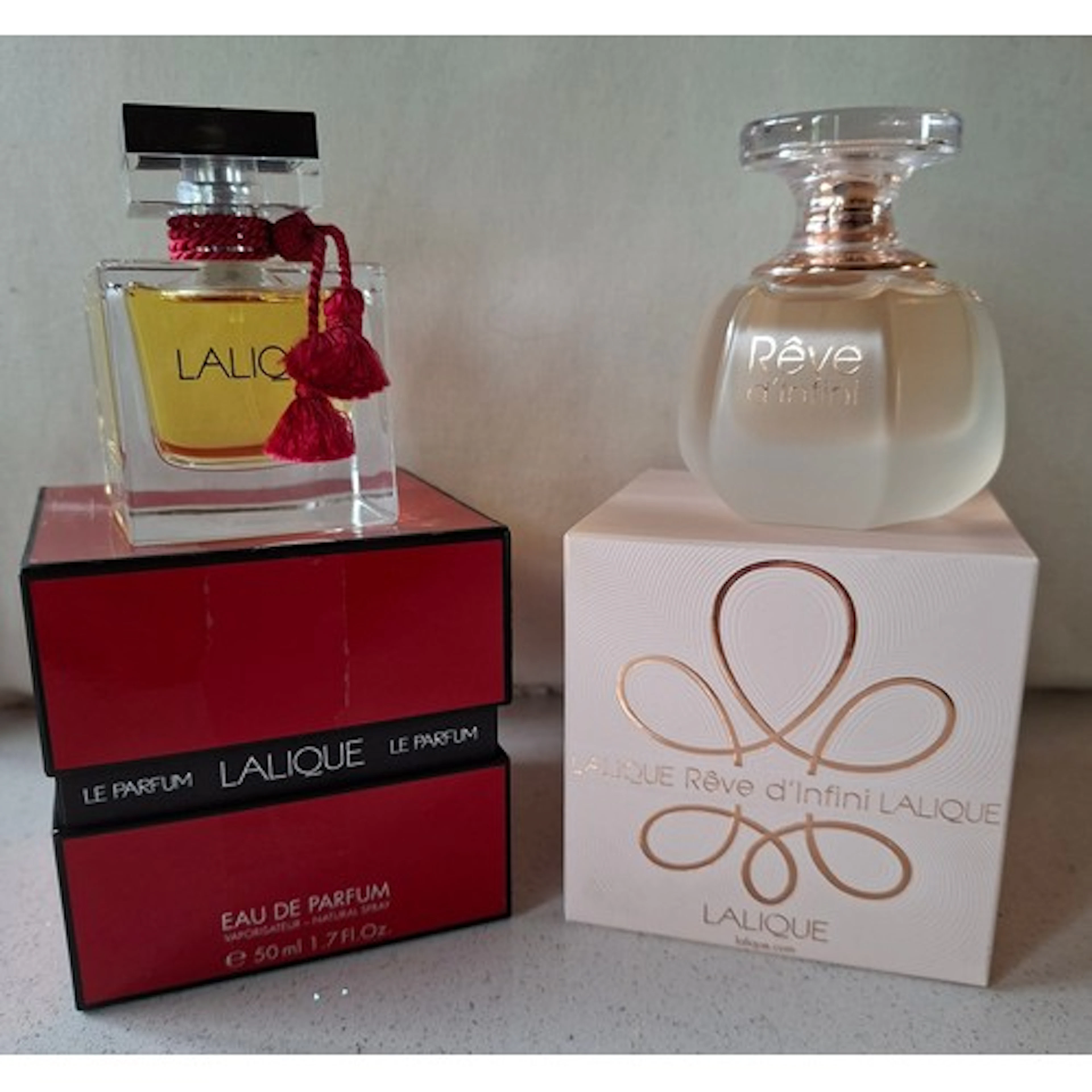 Lalique- Two fragrances comprising a bottle of Reve d'Infini...