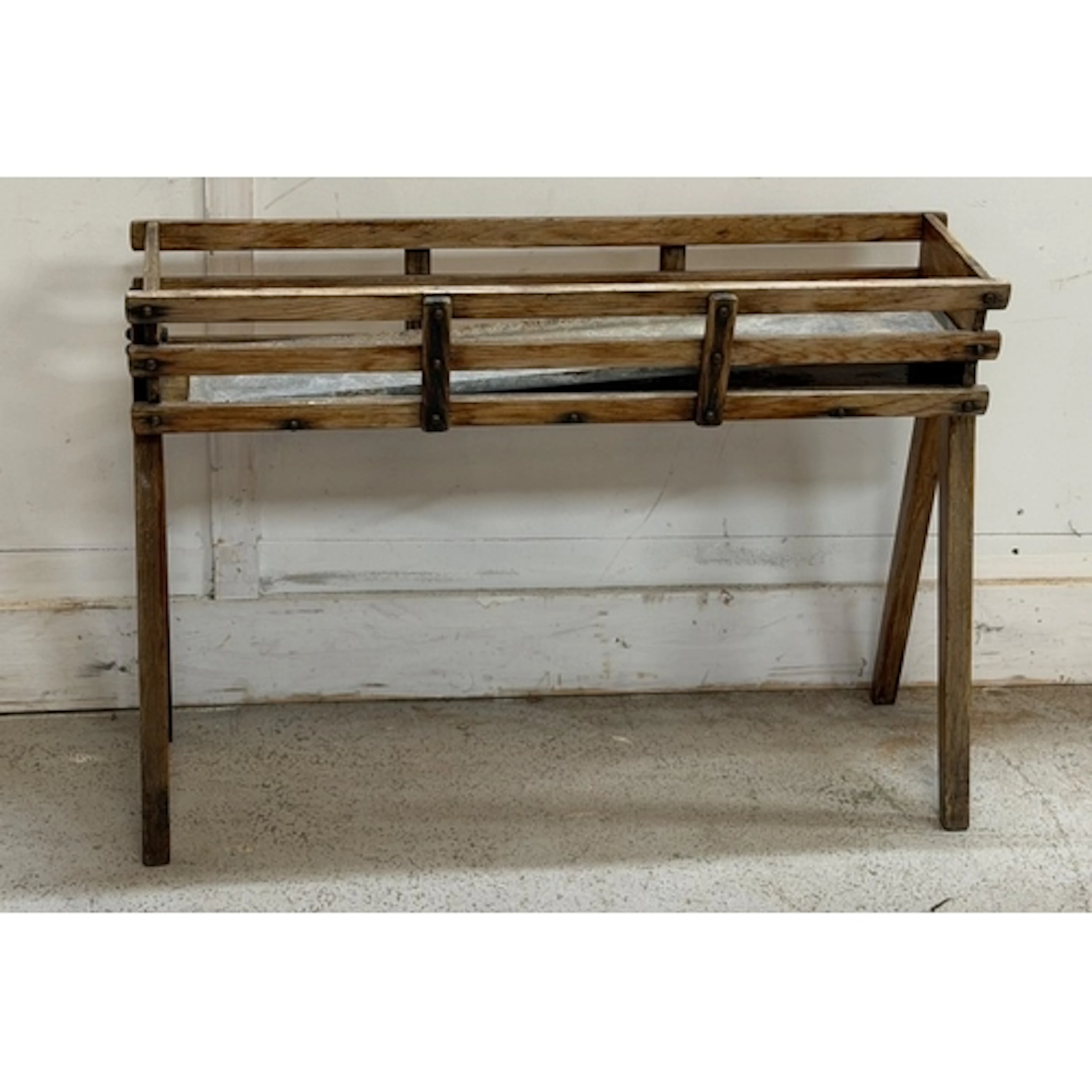 A wooden flower stand on legs H56cm W73cm D19cm