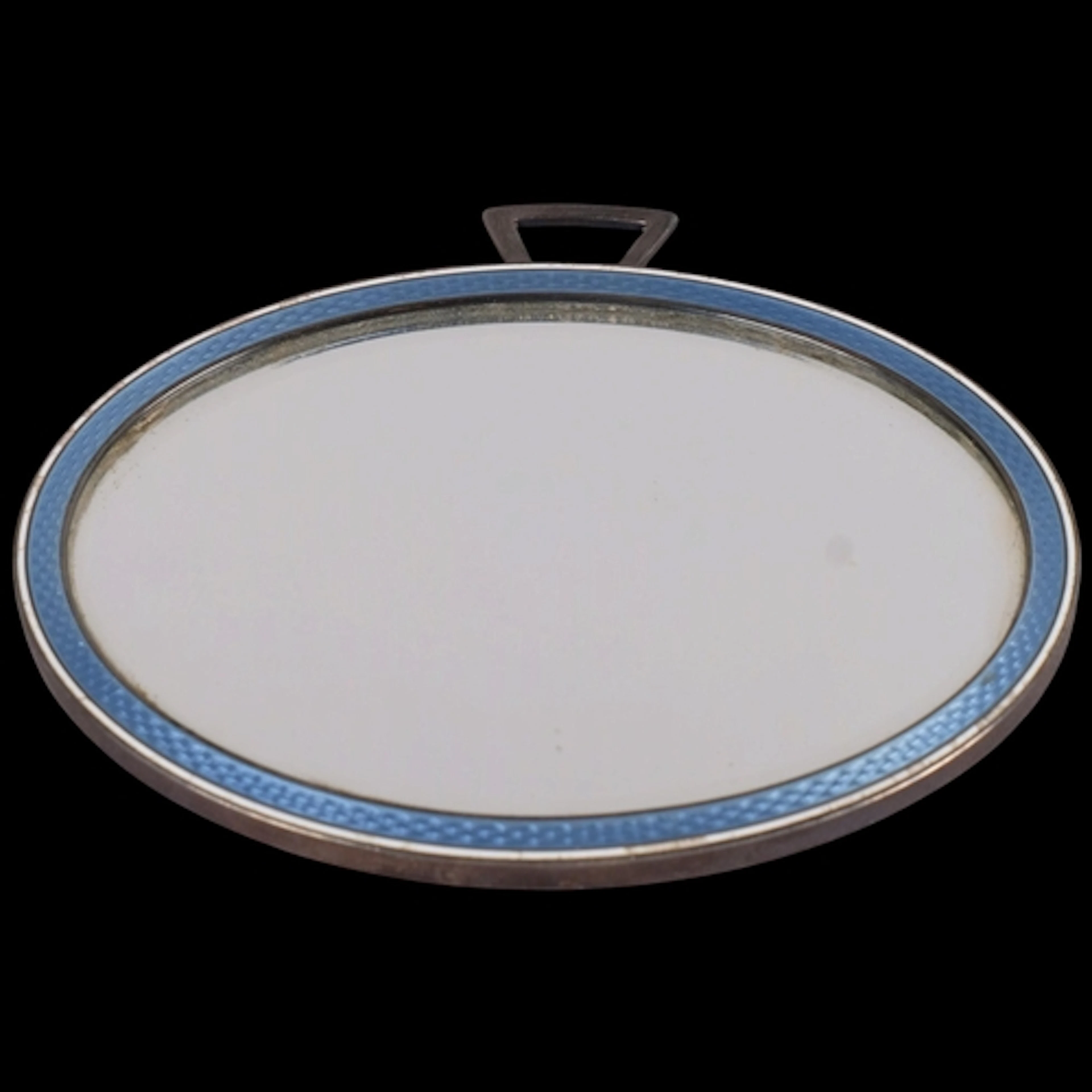 An Art Deco French silver and enamel miror, oval form, with ...