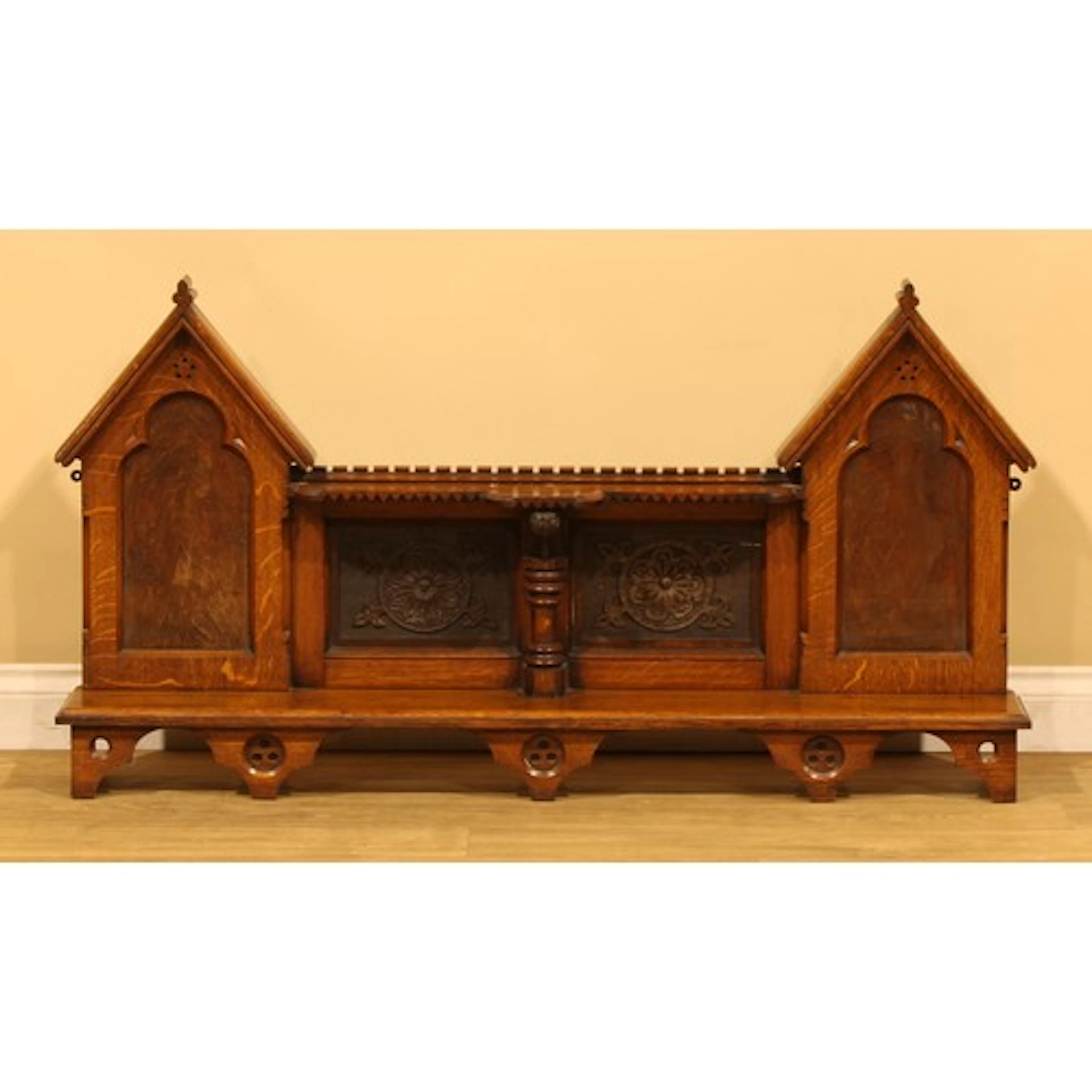 An Arts & Crafts period Gothic Revival oak architectural wal...