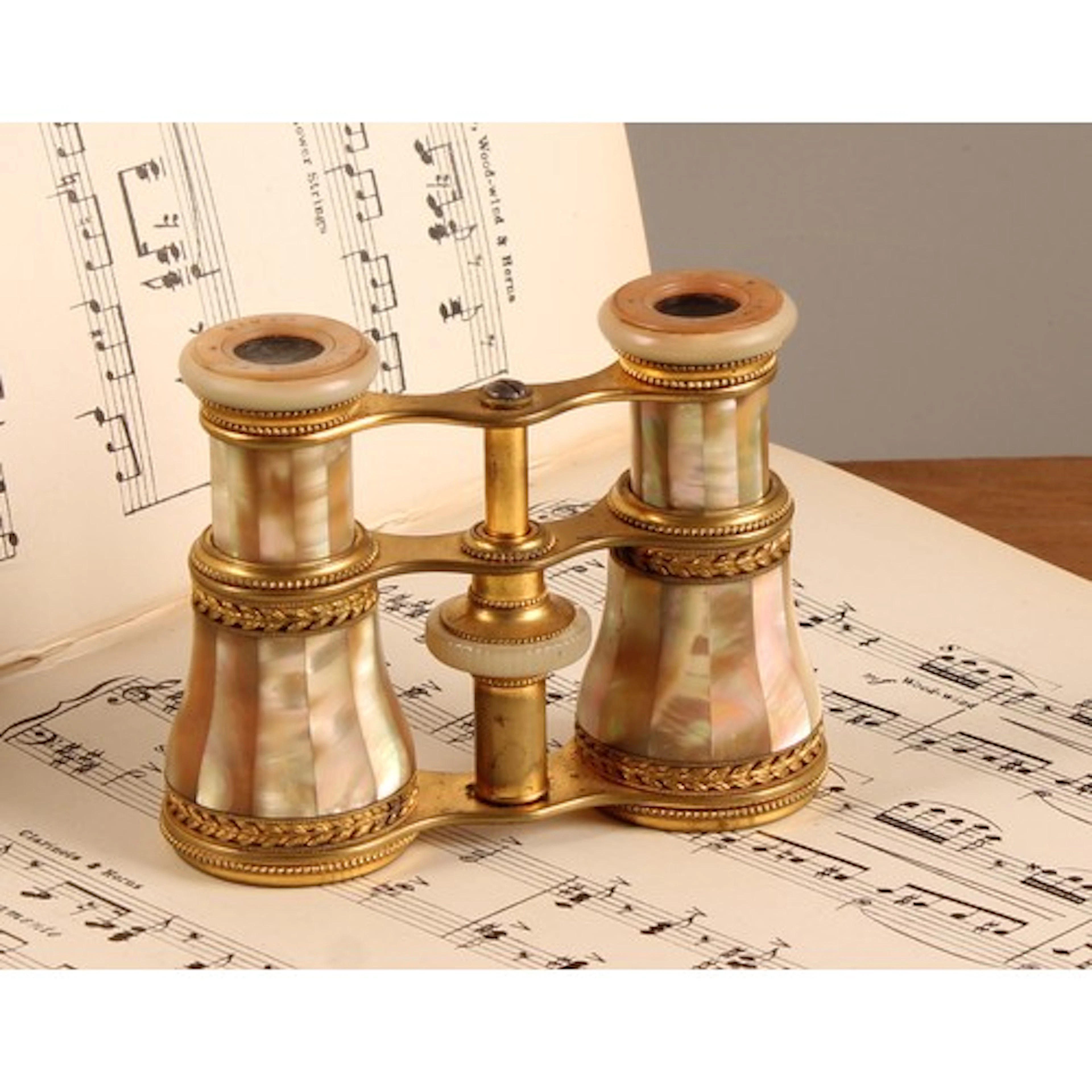 A pair of 19th century French mother-of-pearl and gilt metal...