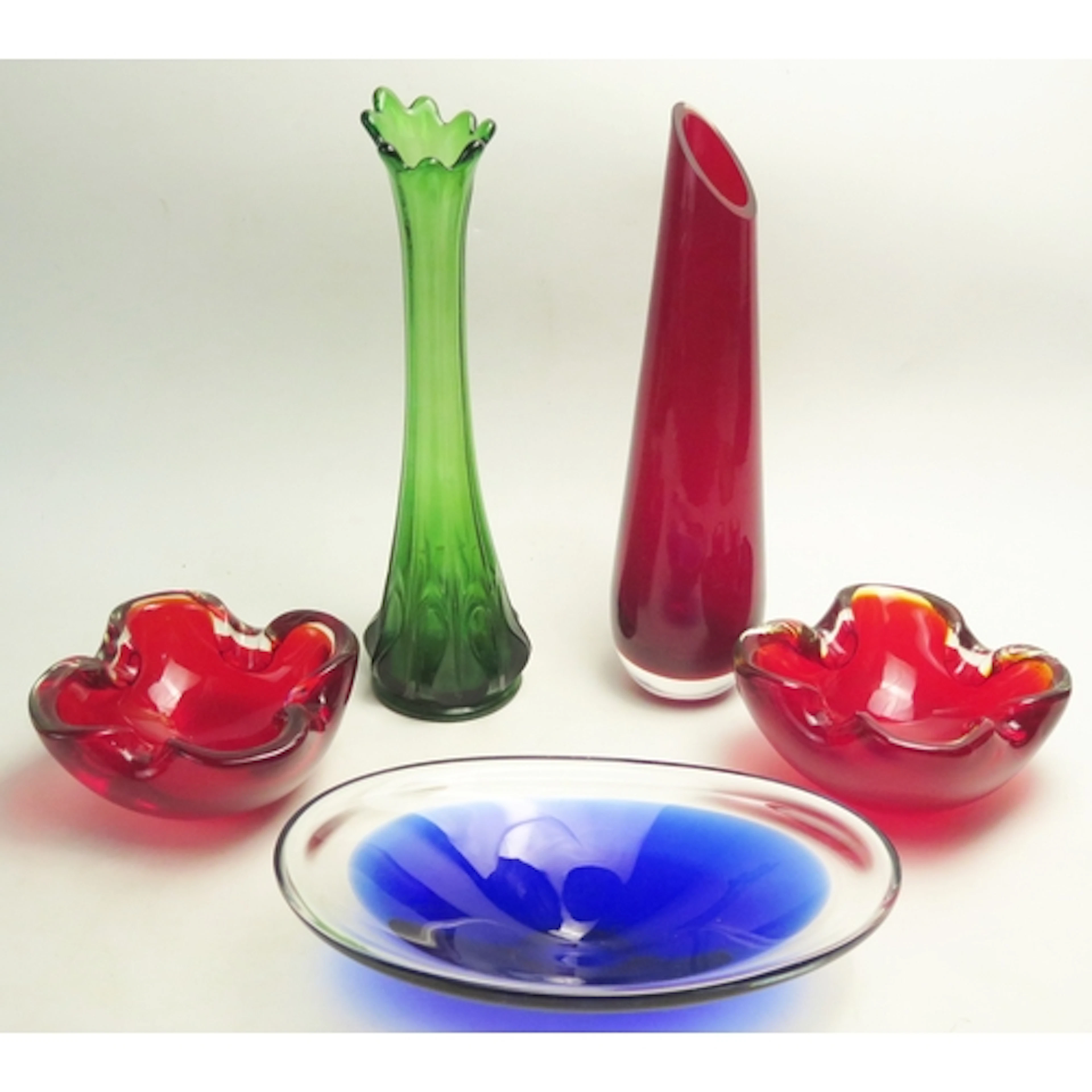 A ruby glass slender tapering vase, with angled rim, 30cm hi...