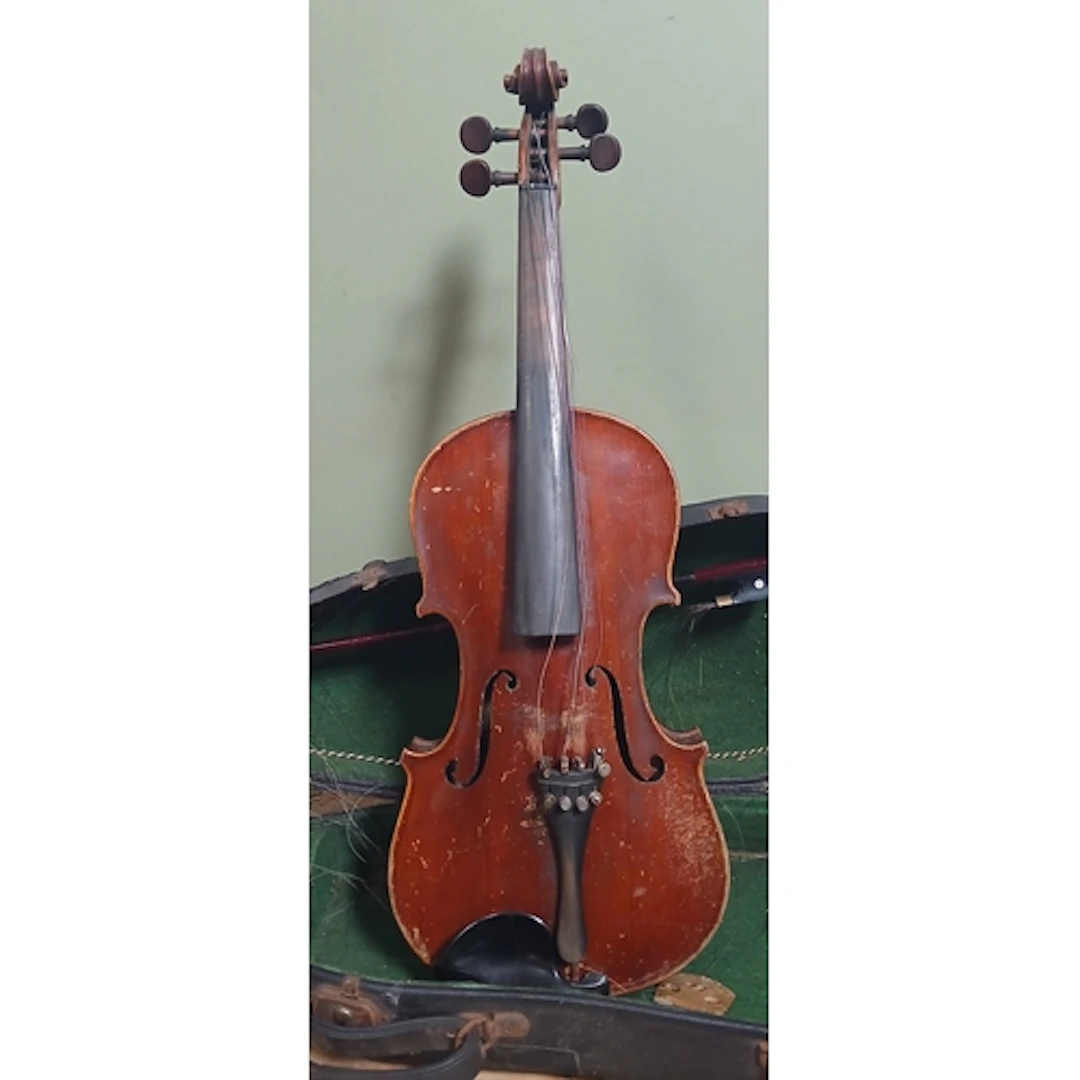 A violin labelled Antonio Martello with hard case and bow.
