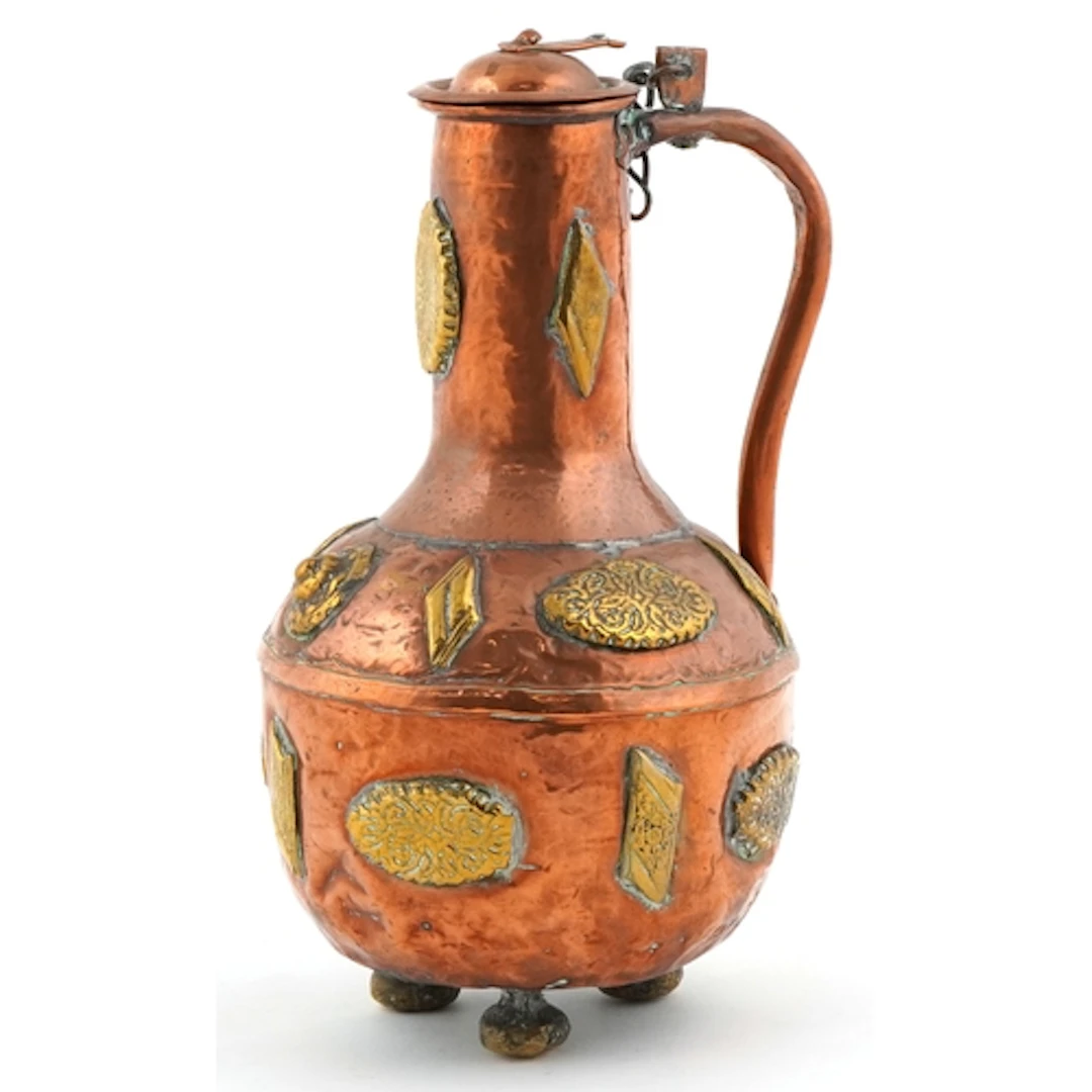 Antique Middle Eastern copper and brass vessel raised on thr...