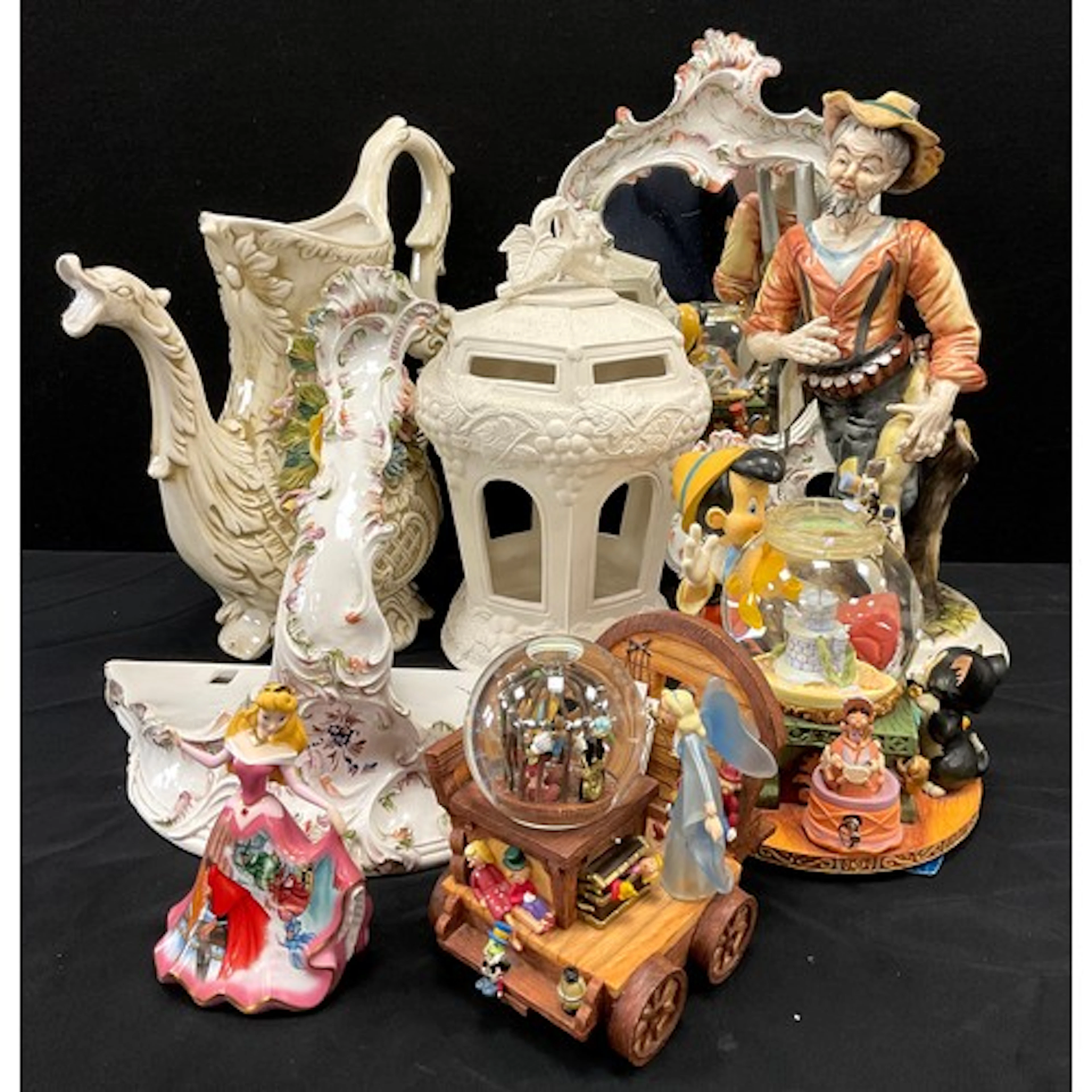 A Disney clock work musical fish tank, with Pinocchio & Figa...