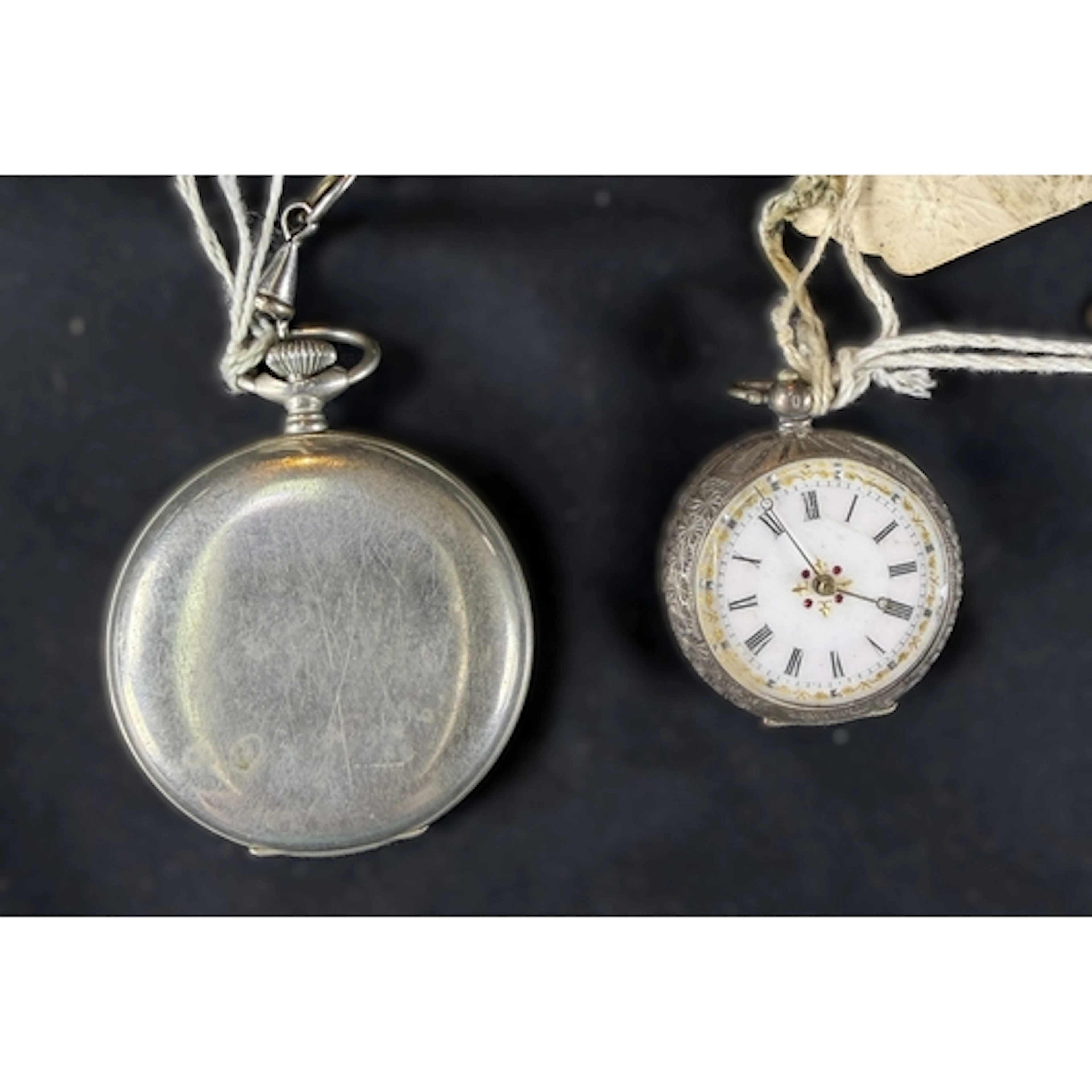 An open faced key wound fob watch in chased white metal case...