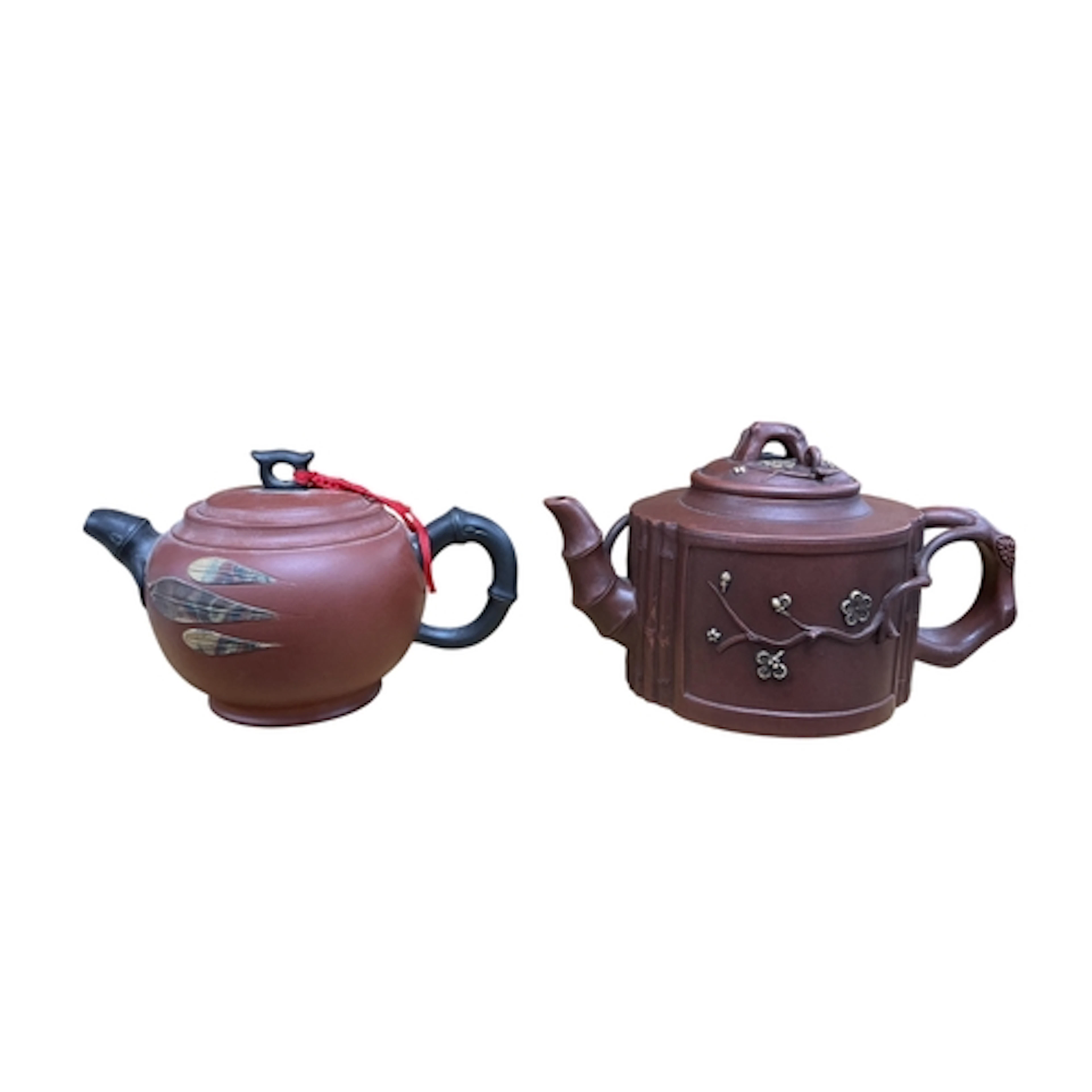 Two Chinese Yixing teapots to include a naturalistic example...