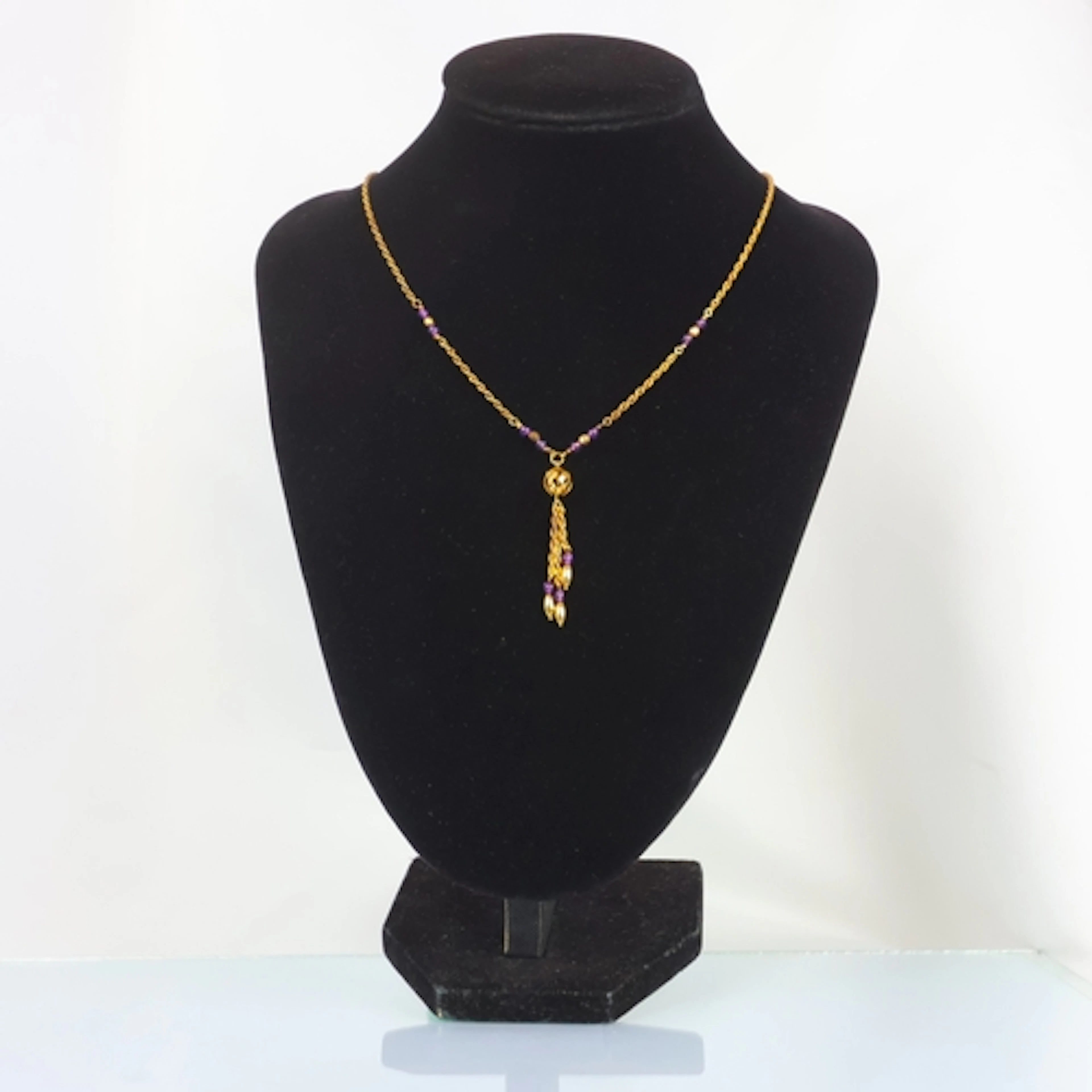 A contemporary 9ct gold amethyst necklace, the rope twist ne...