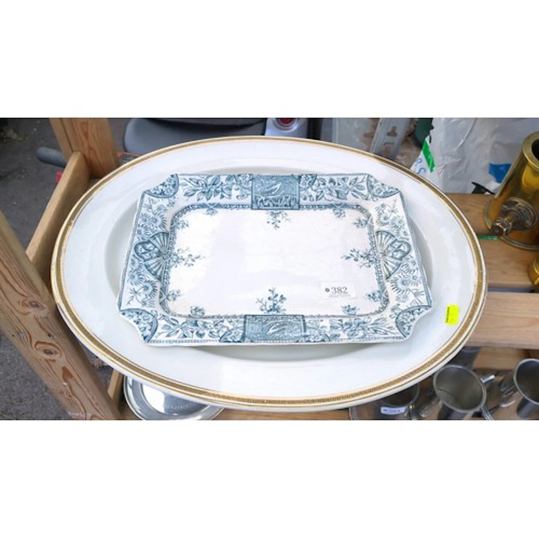 Two English earthenware serving platters: one rectangular, b...