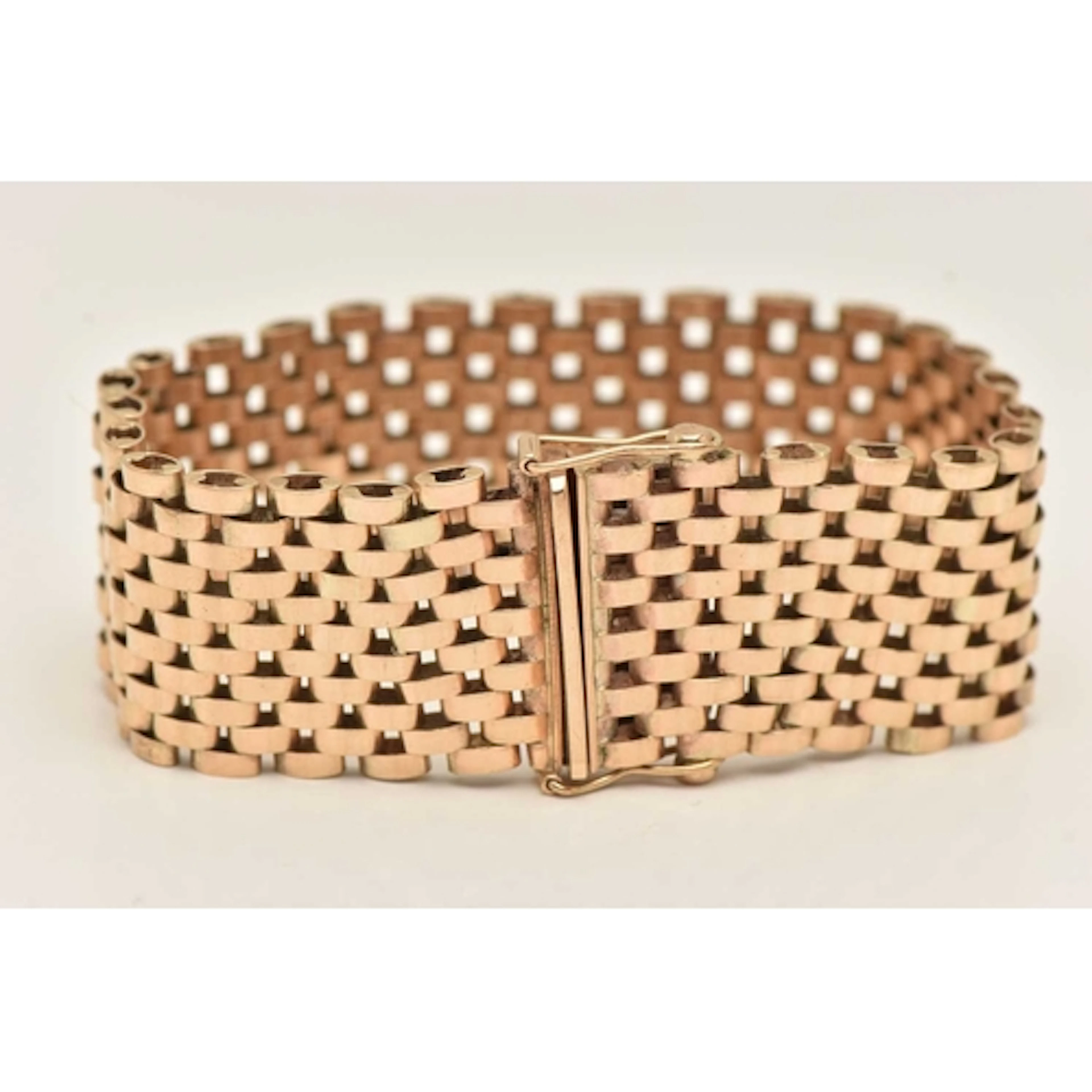 A YELLOW METAL WIDE BRICK LINK BRACELET, approximate width 2...