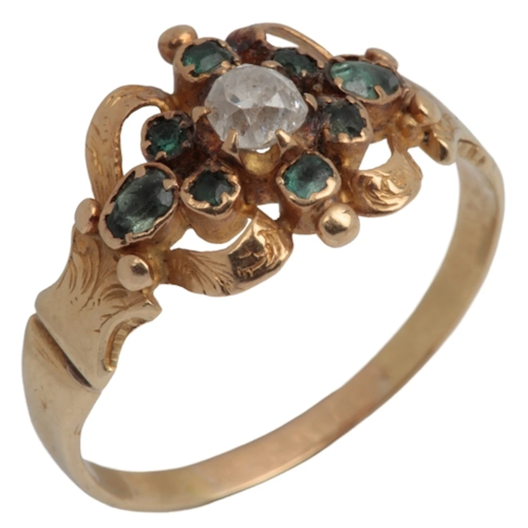An emerald and diamond ring, mid 19th century, centring on a...