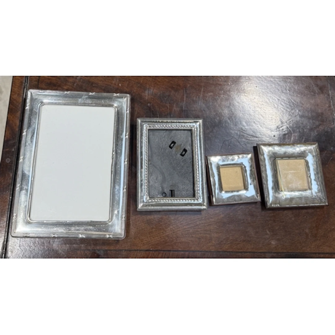 4 CONTEMPORARY SILVER-MOUNTED PHOTOGRAPH FRAMES Largest 18.6...