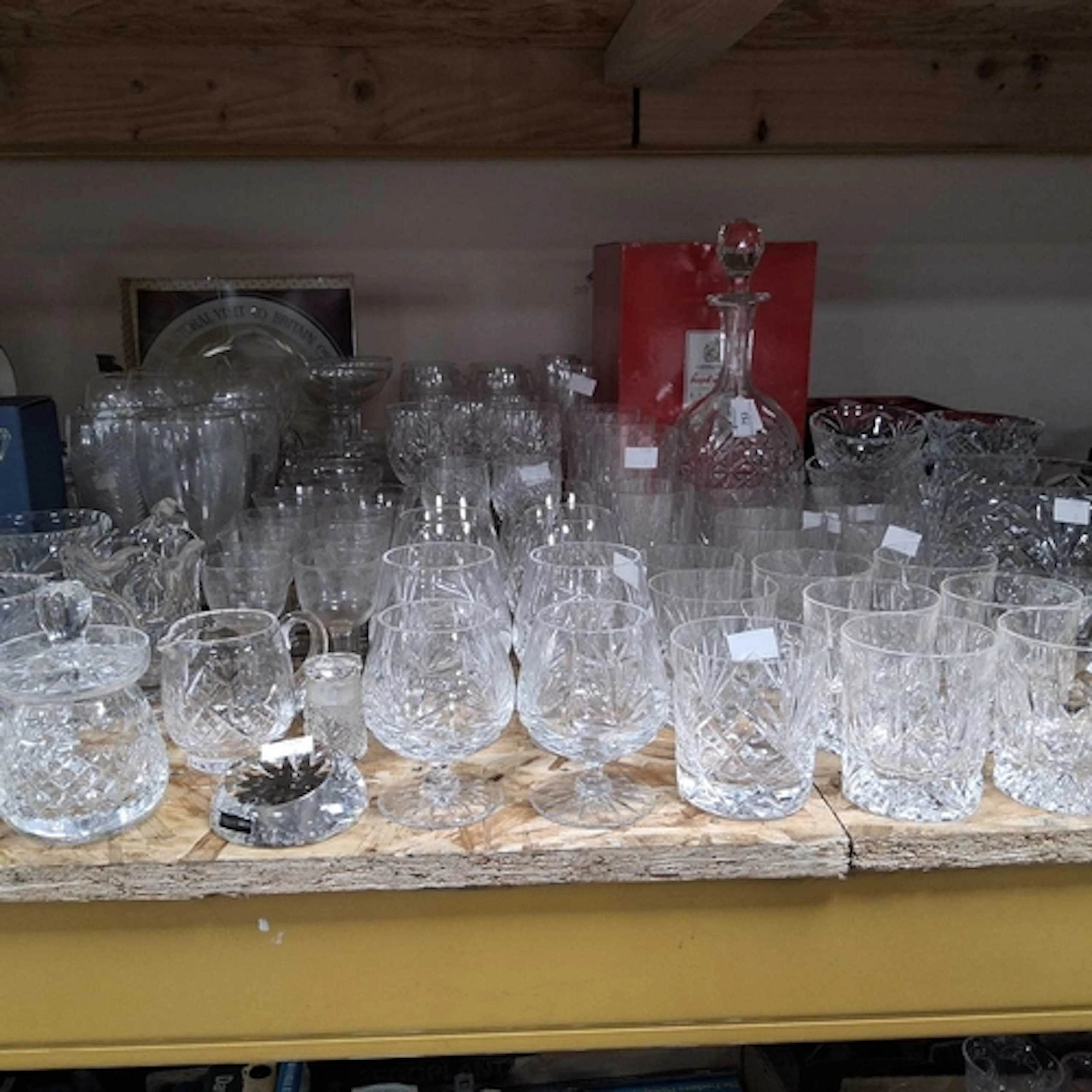 A COLLECTION OF MOSTLY CRYSTAL CUT GLASSWARE comprising a gr...