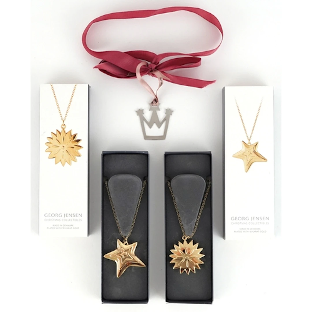Georg Jensen, two 18ct gold Christmas Collectables pendant o...