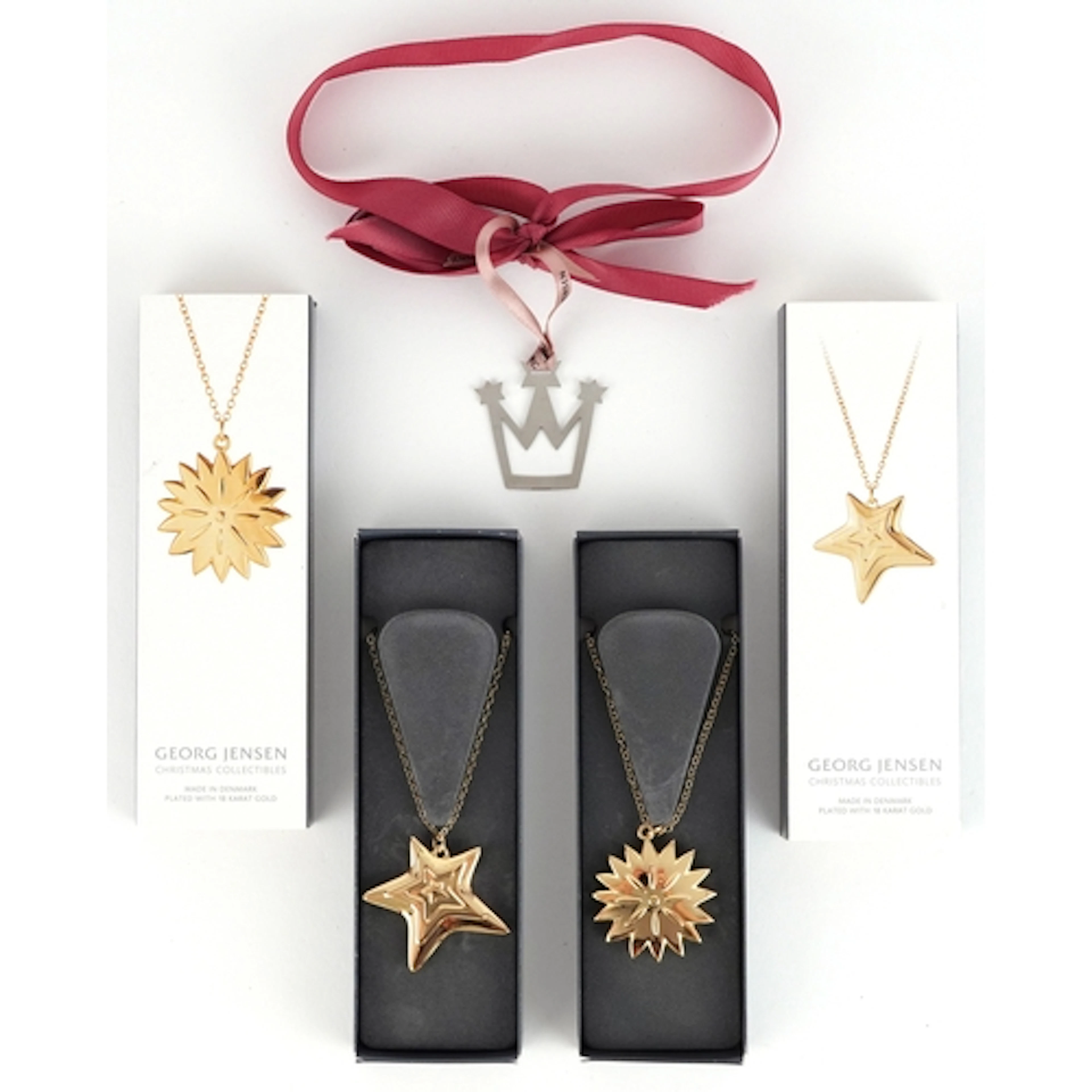 Georg Jensen, two 18ct gold Christmas Collectables pendant o...