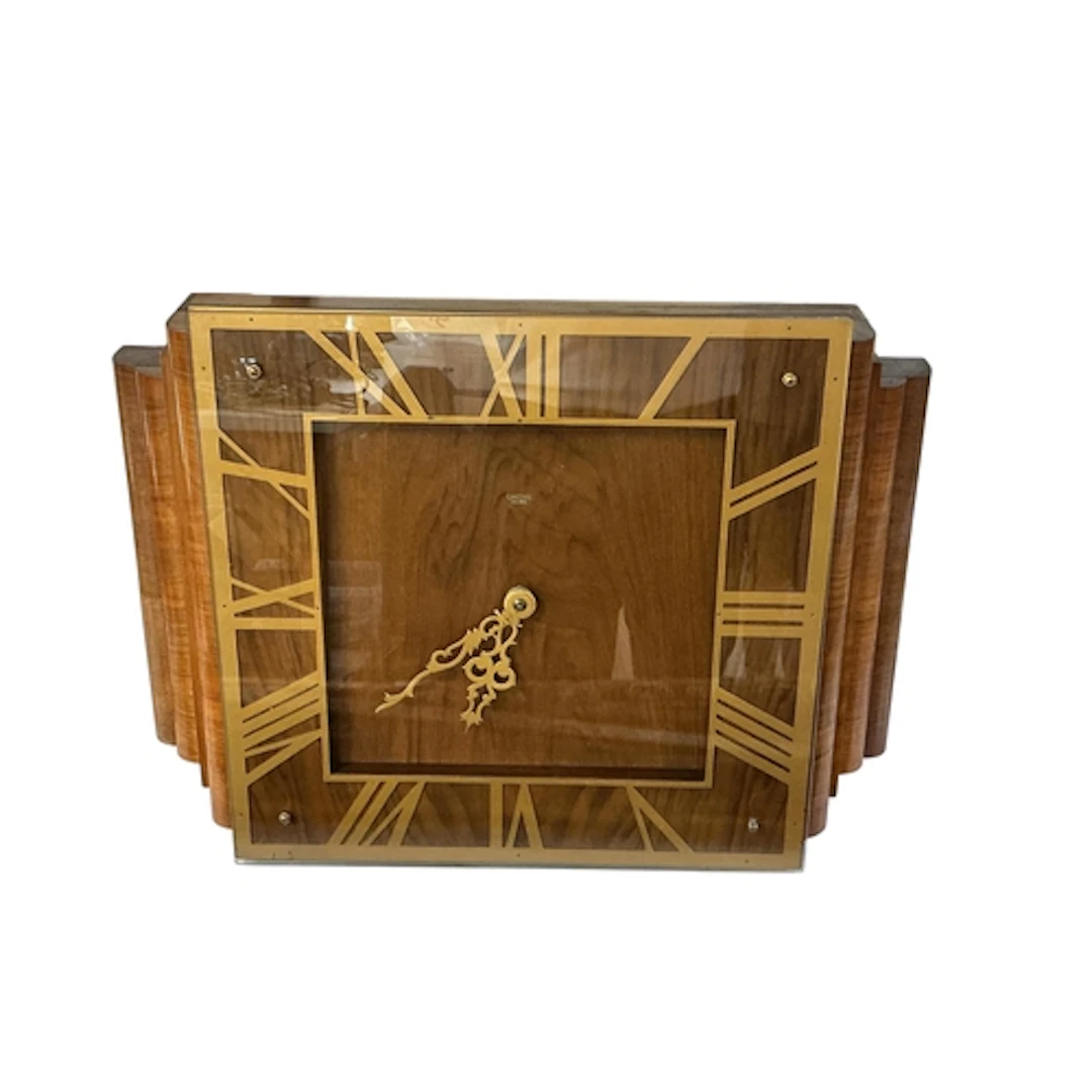 An Art Deco style walnut electric wall clock with Roman nume...
