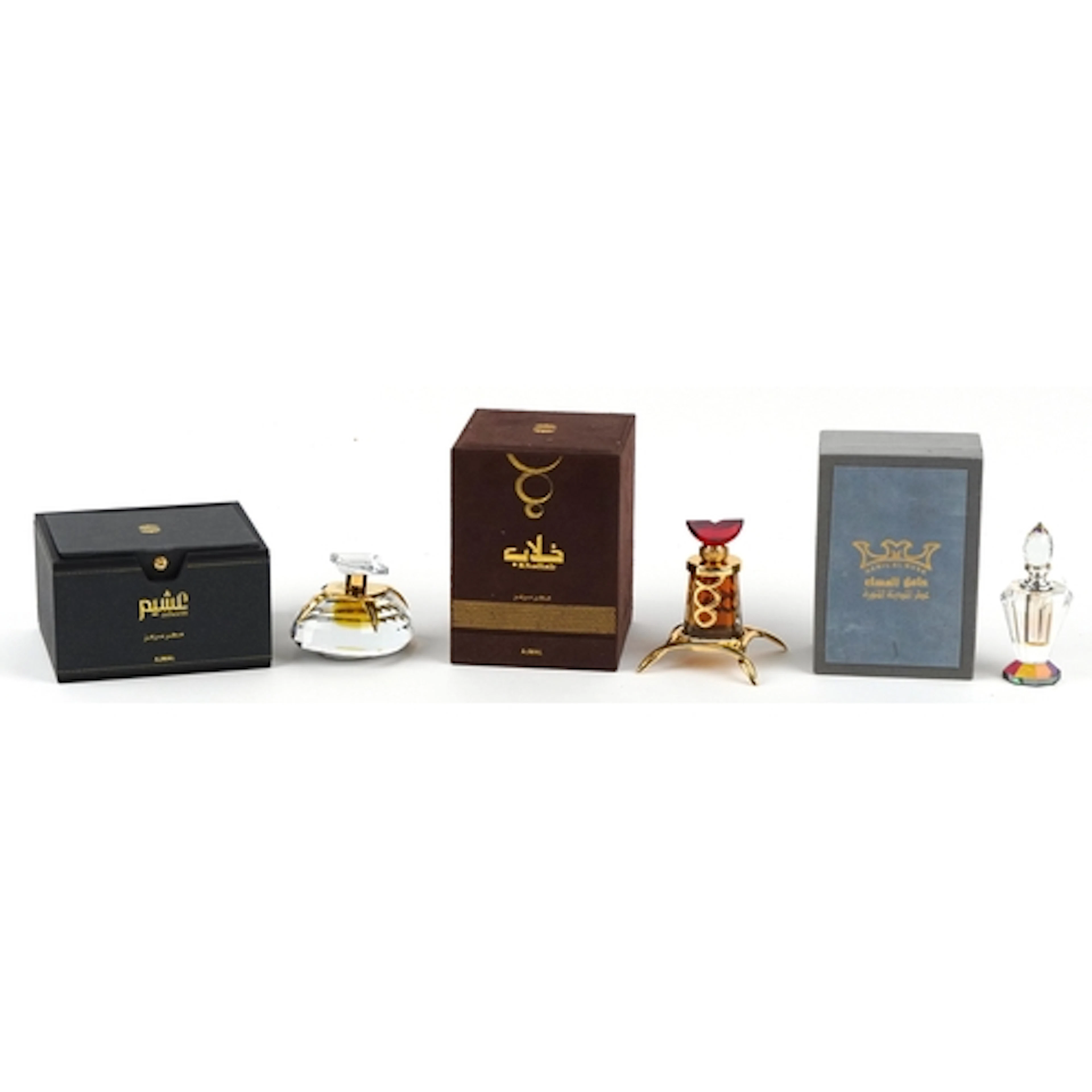 Three Ajmal perfume bottles with some contents and fitted bo...