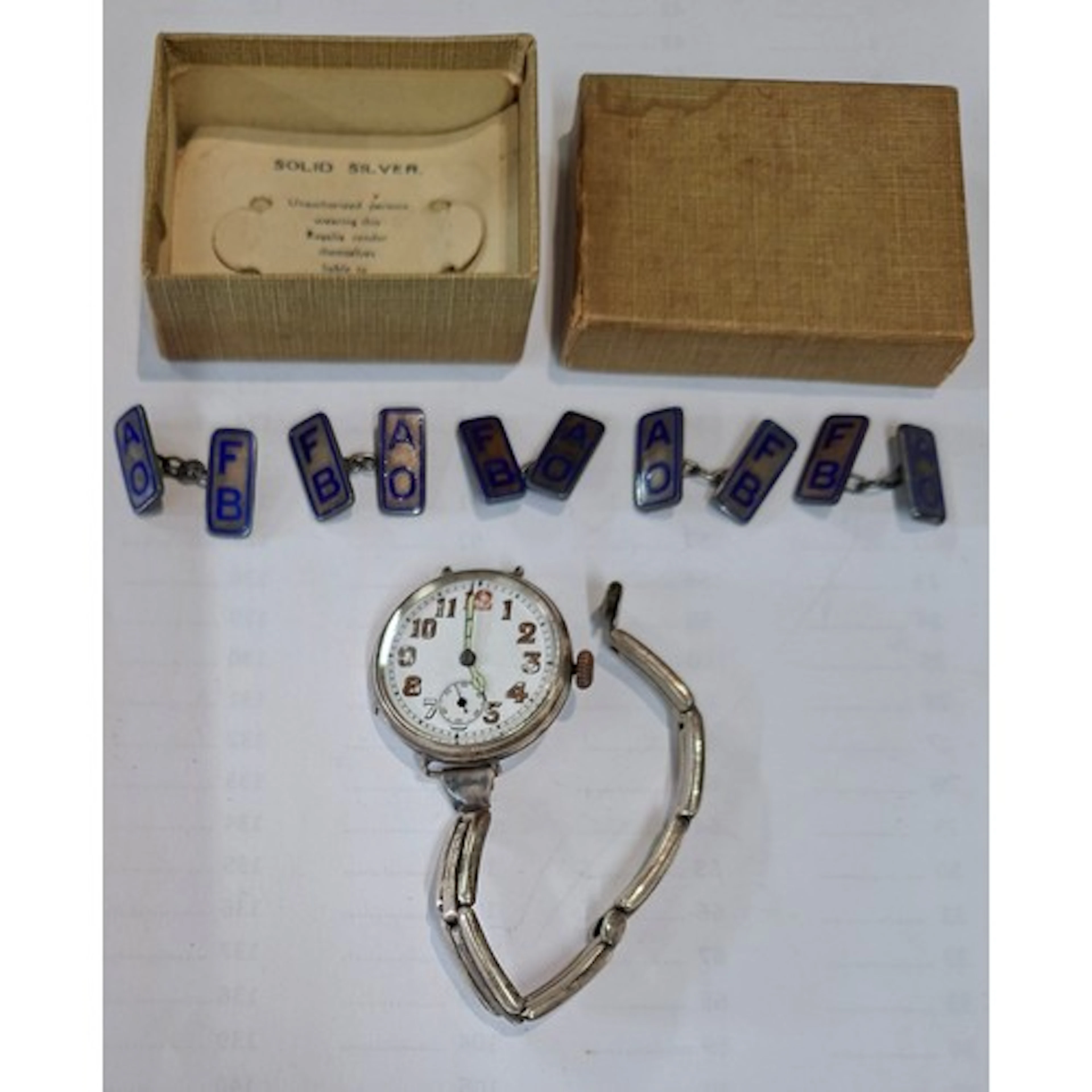 A WW1 silver trench watch A/F and five silver and enamel cuf...