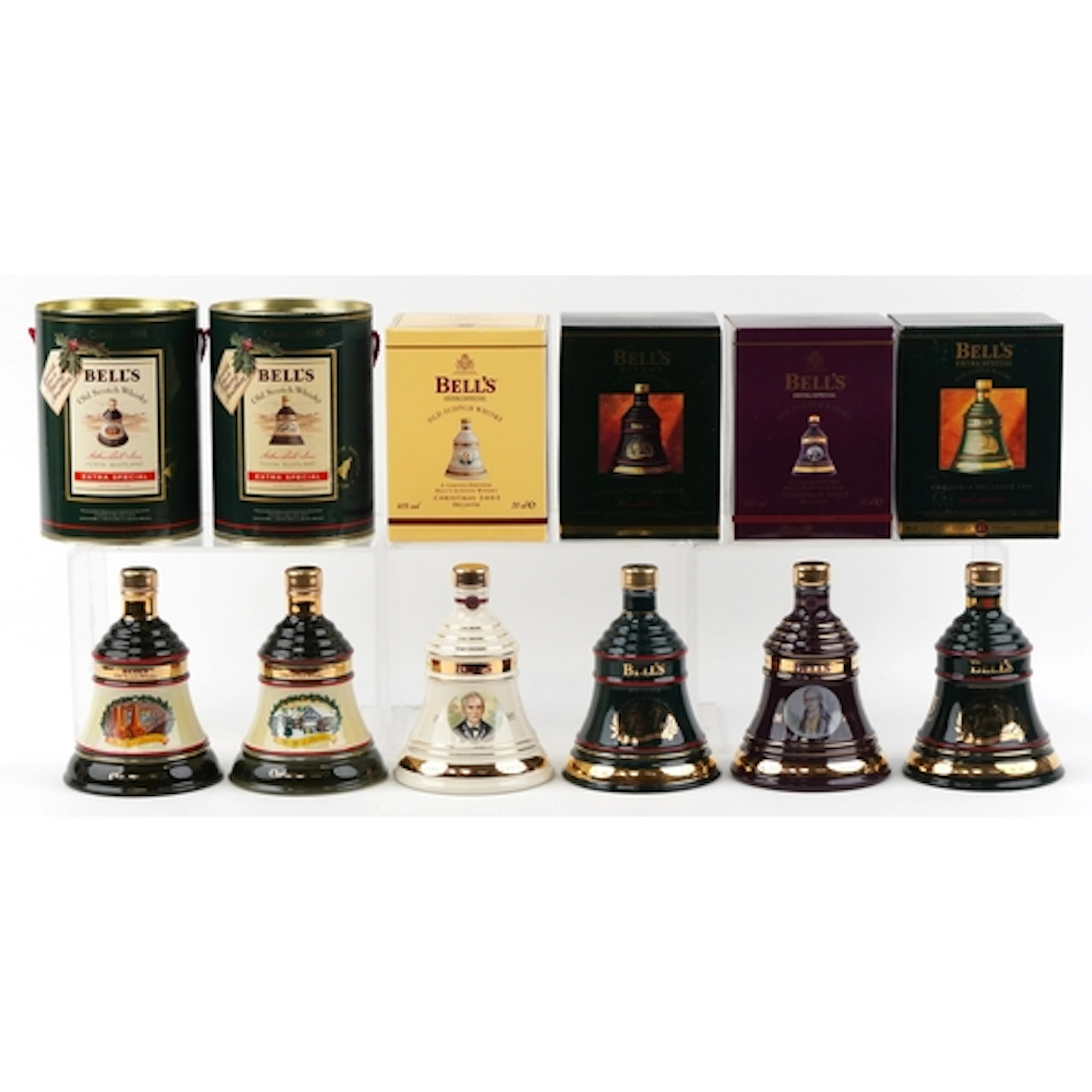 Six Bell's Christmas edition whisky decanters comprising 199...