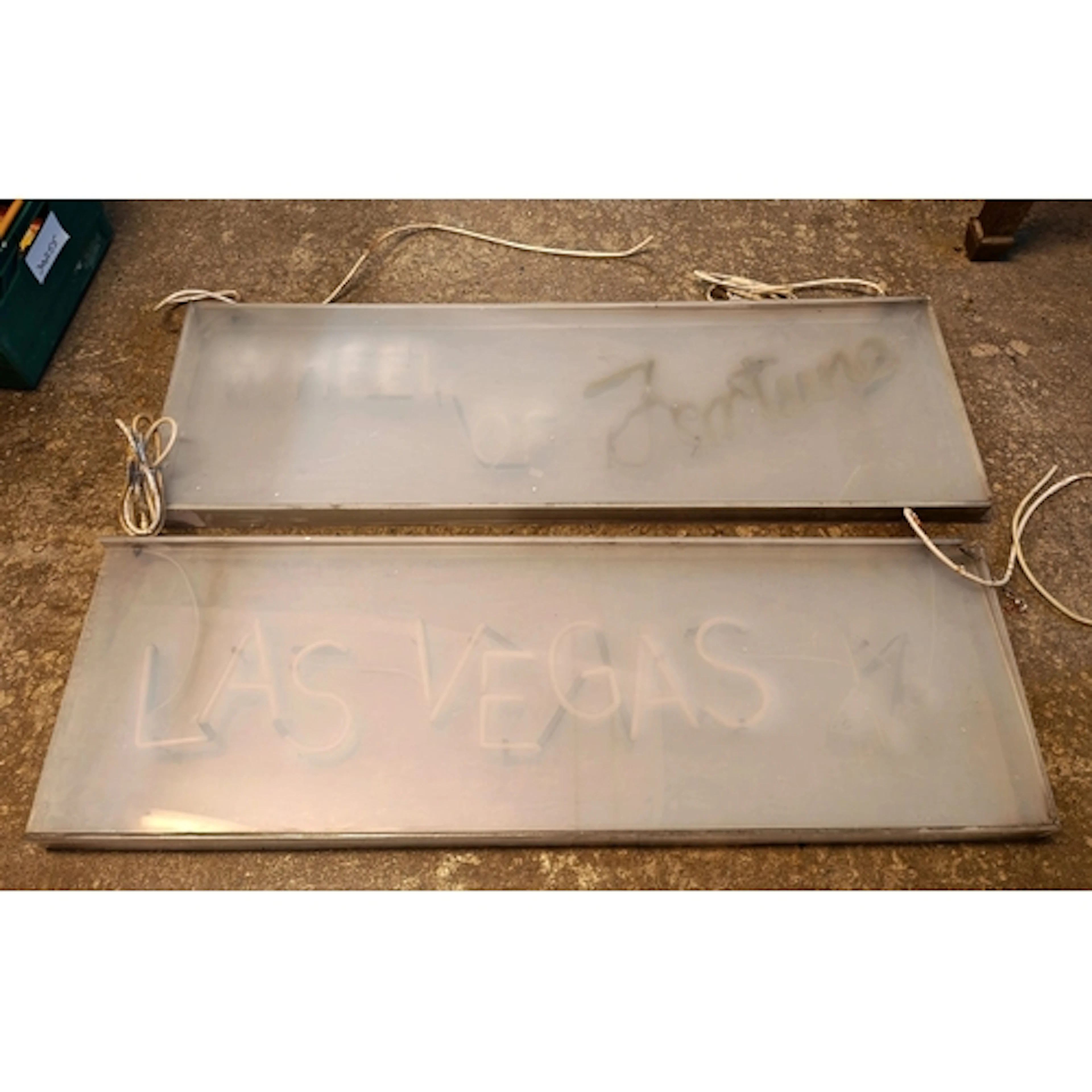 Two perspex cased neon signs: 'Las Vegas' and 'Wheel of Fort...