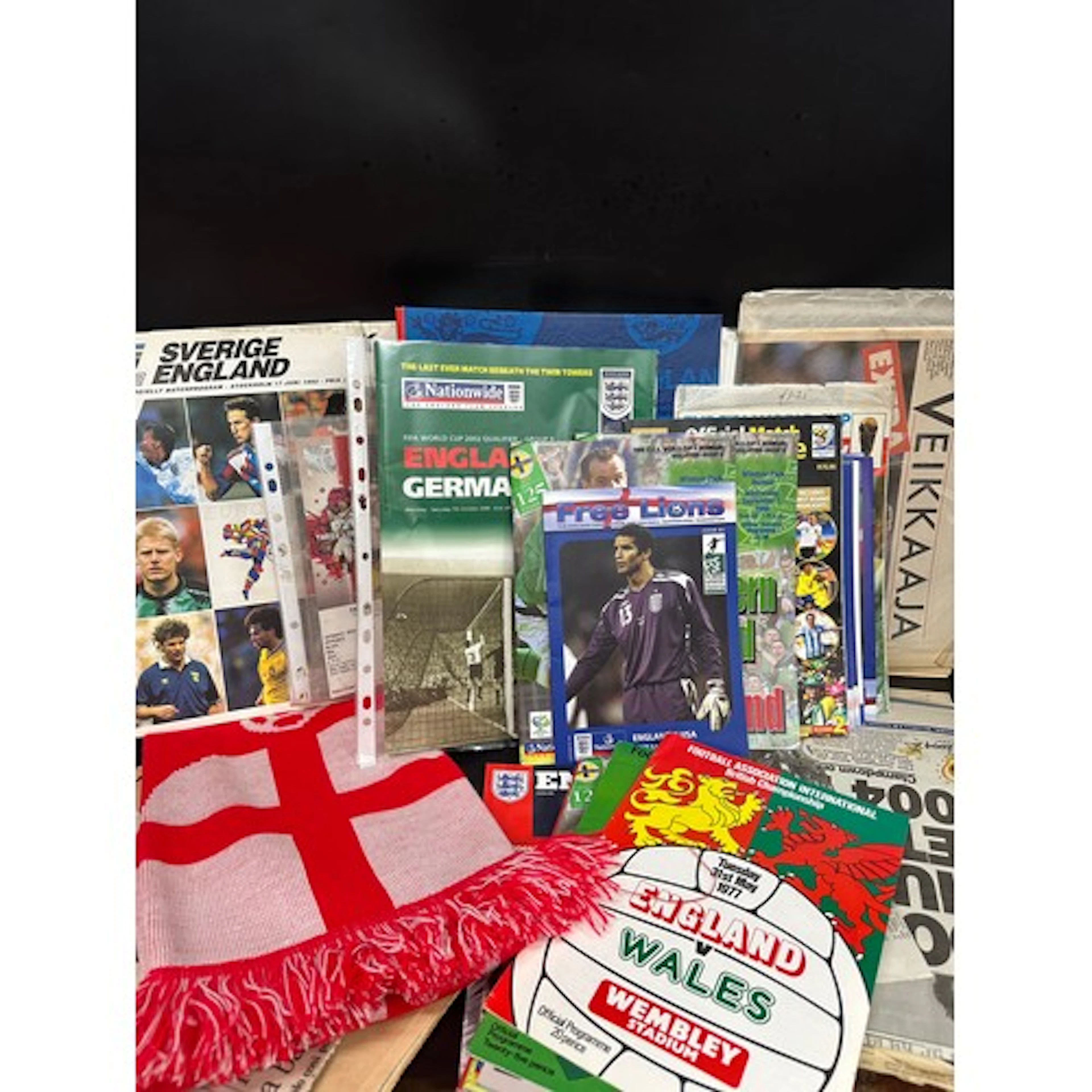 A collection of football ephemera, World Cup programmes, tea...