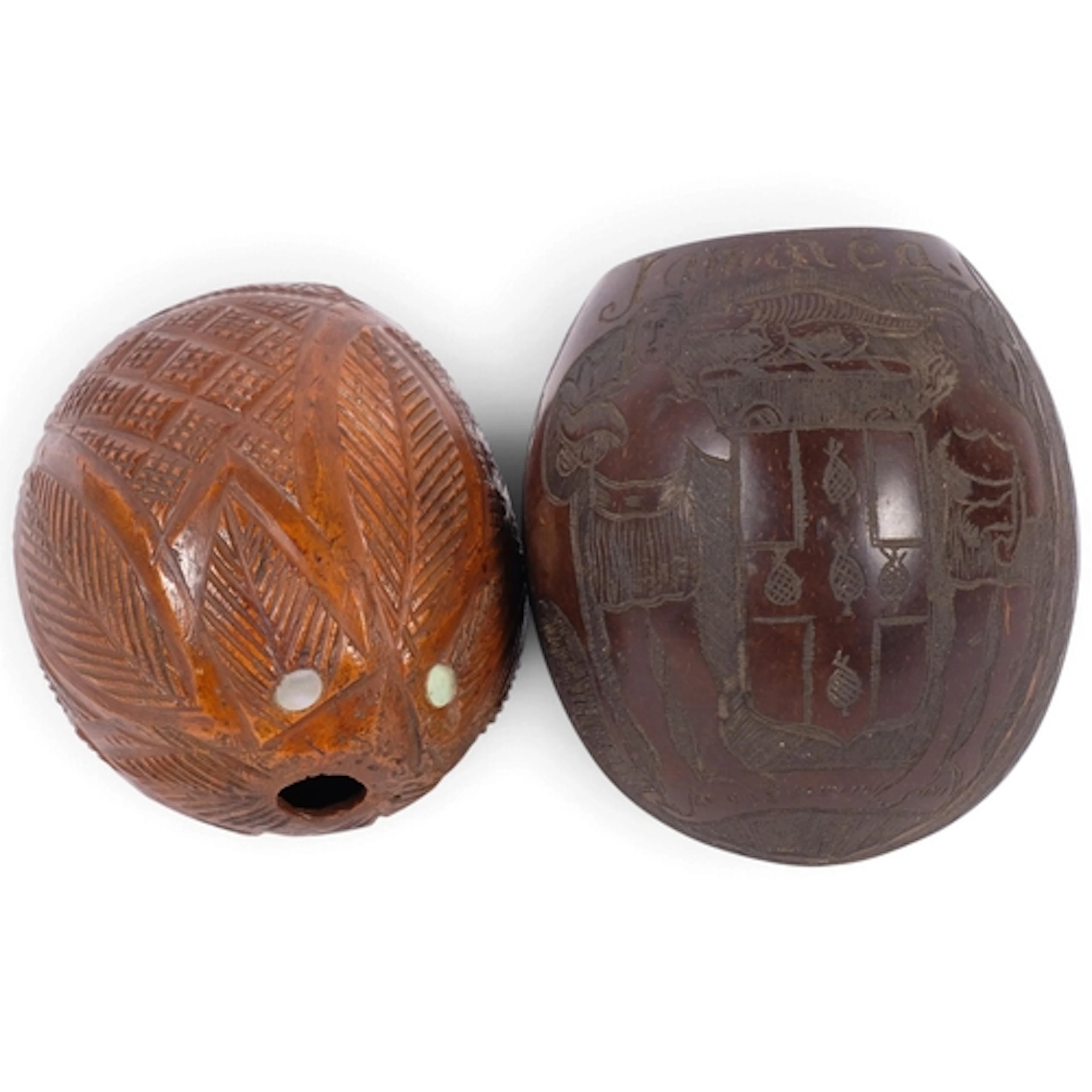 A 19th century coconut shell bugbear, allover carved decorat...