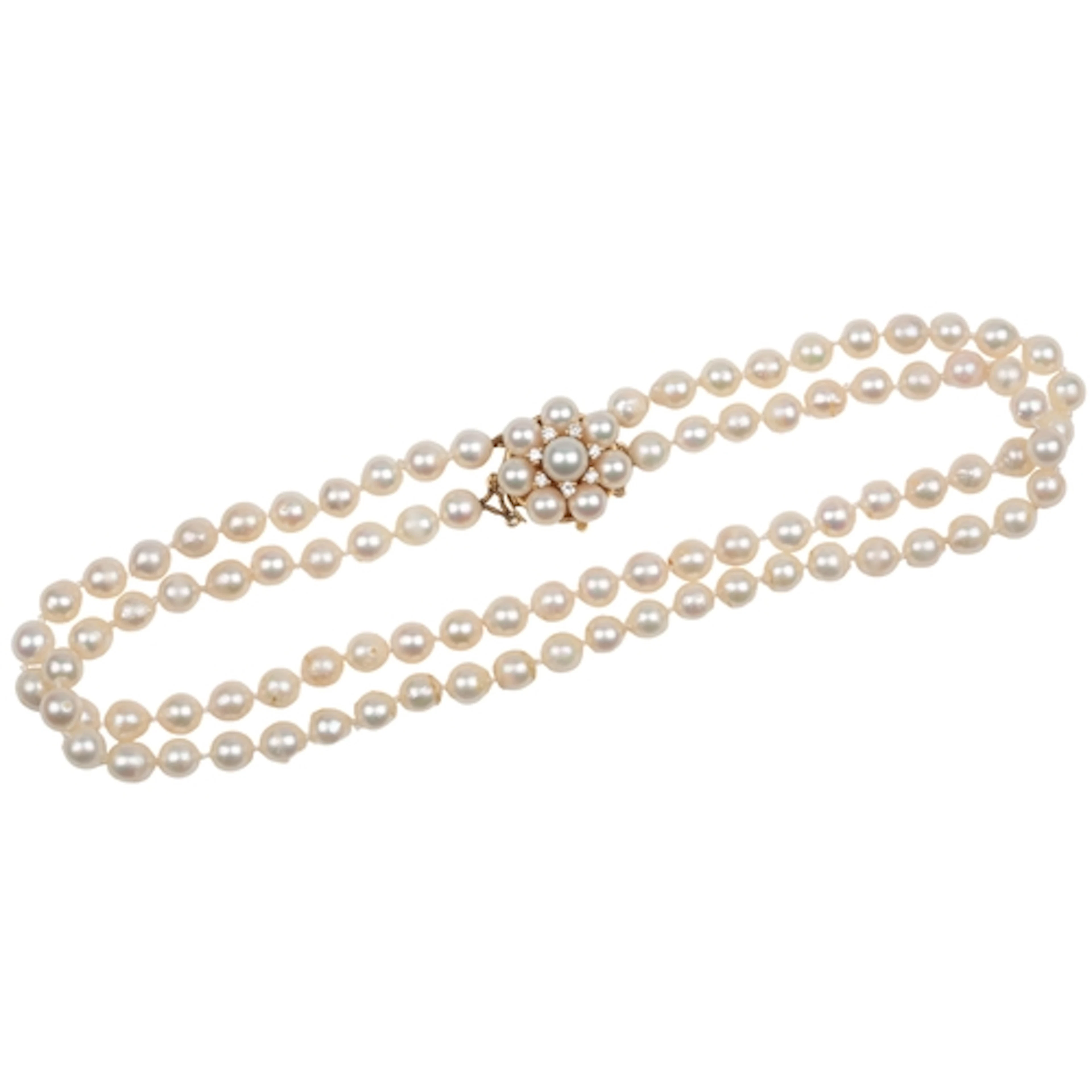 A cultured pearl and diamond necklace, composed of two stran...