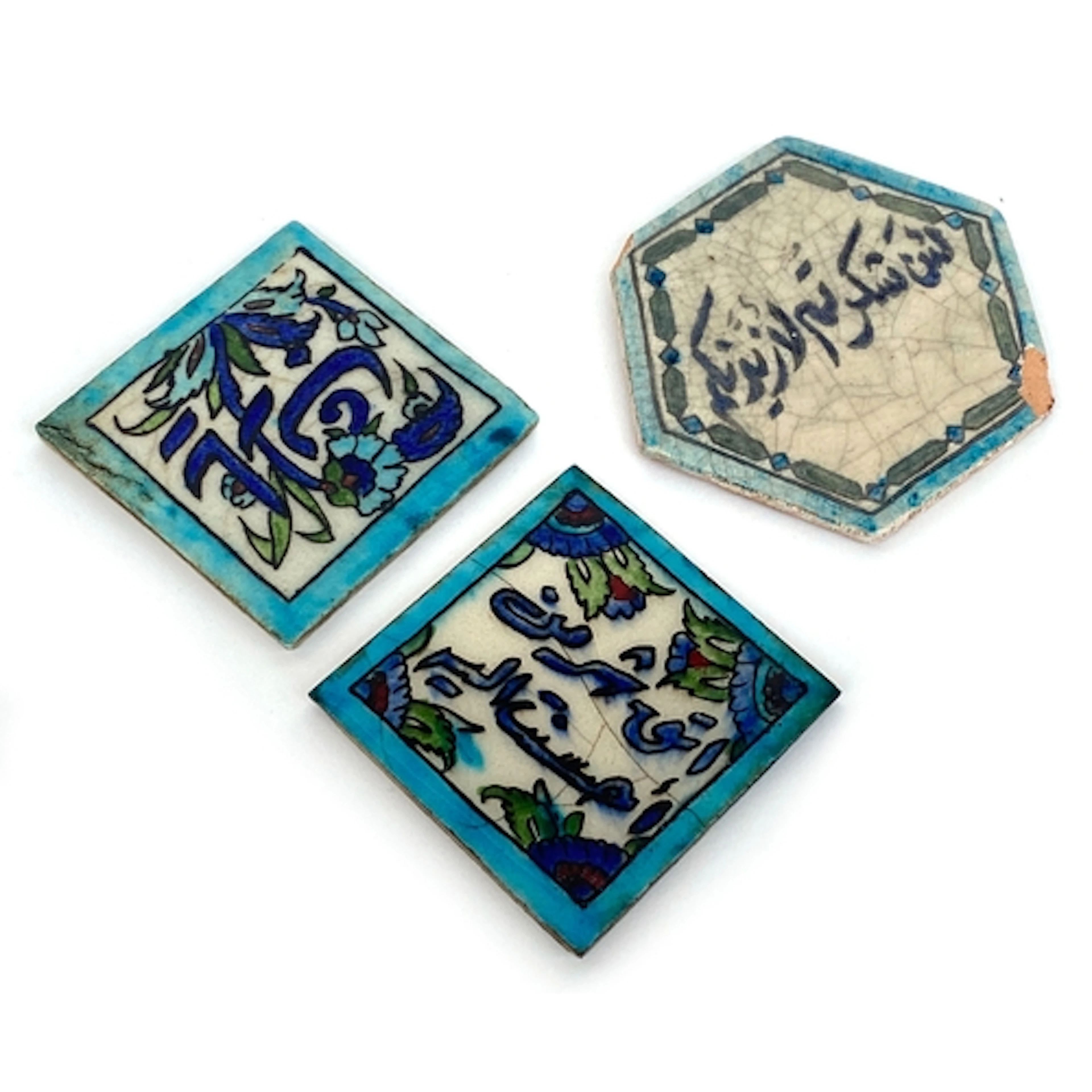 A hexagonal Syrian Iznik style tile, 12cm; together with two...