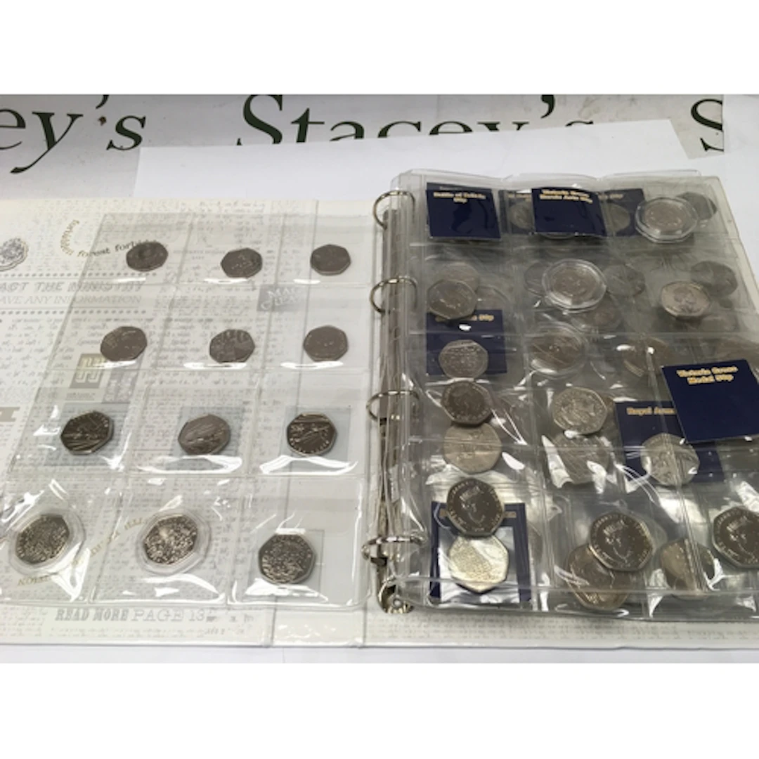 An album of various 50p coins including 2009 Kew Gardens, Ch...