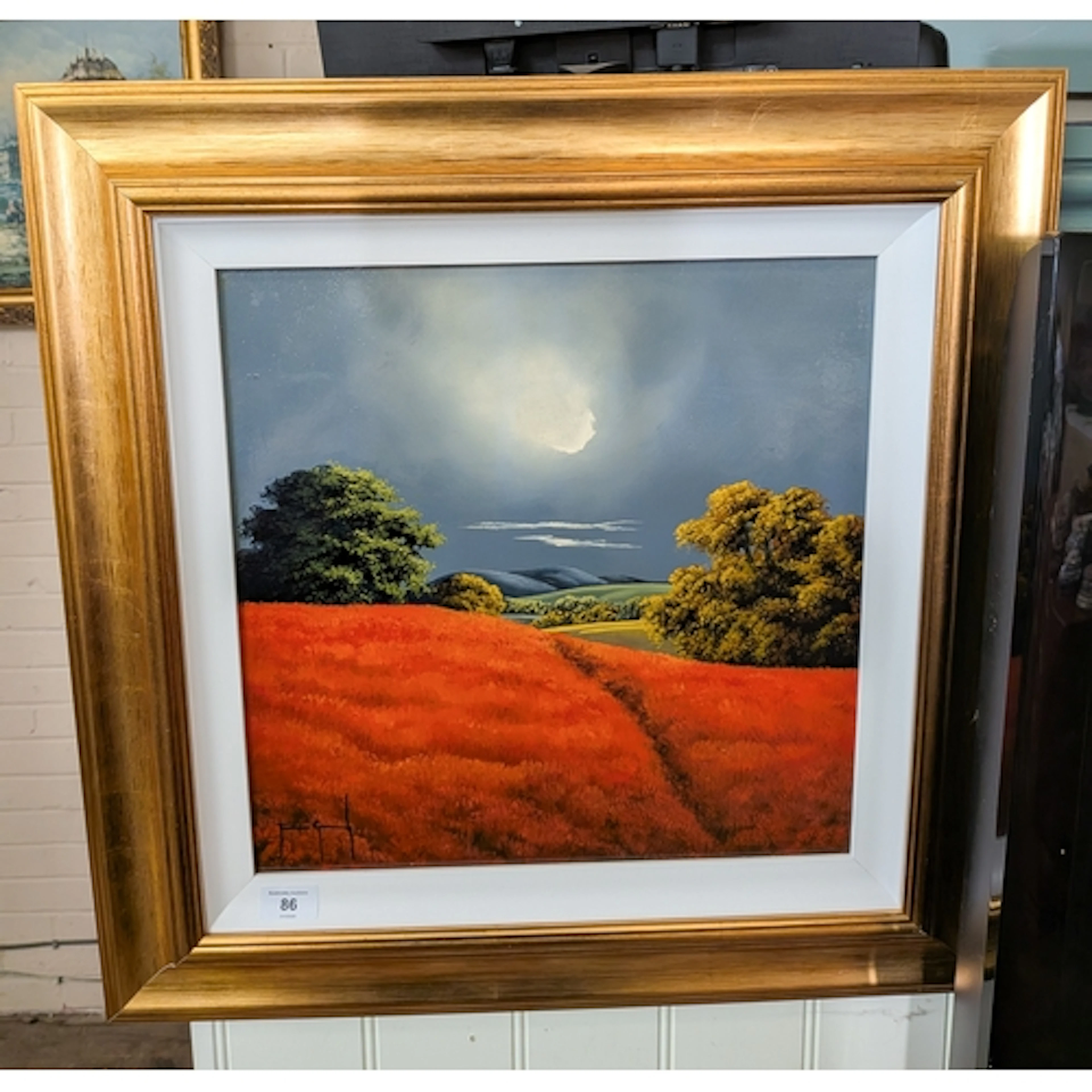 A modern framed painting of a country scene in gilt frame
