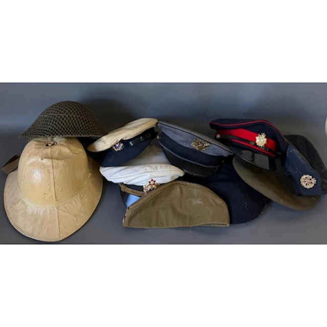 A selection of military caps and hats, various regiments and...