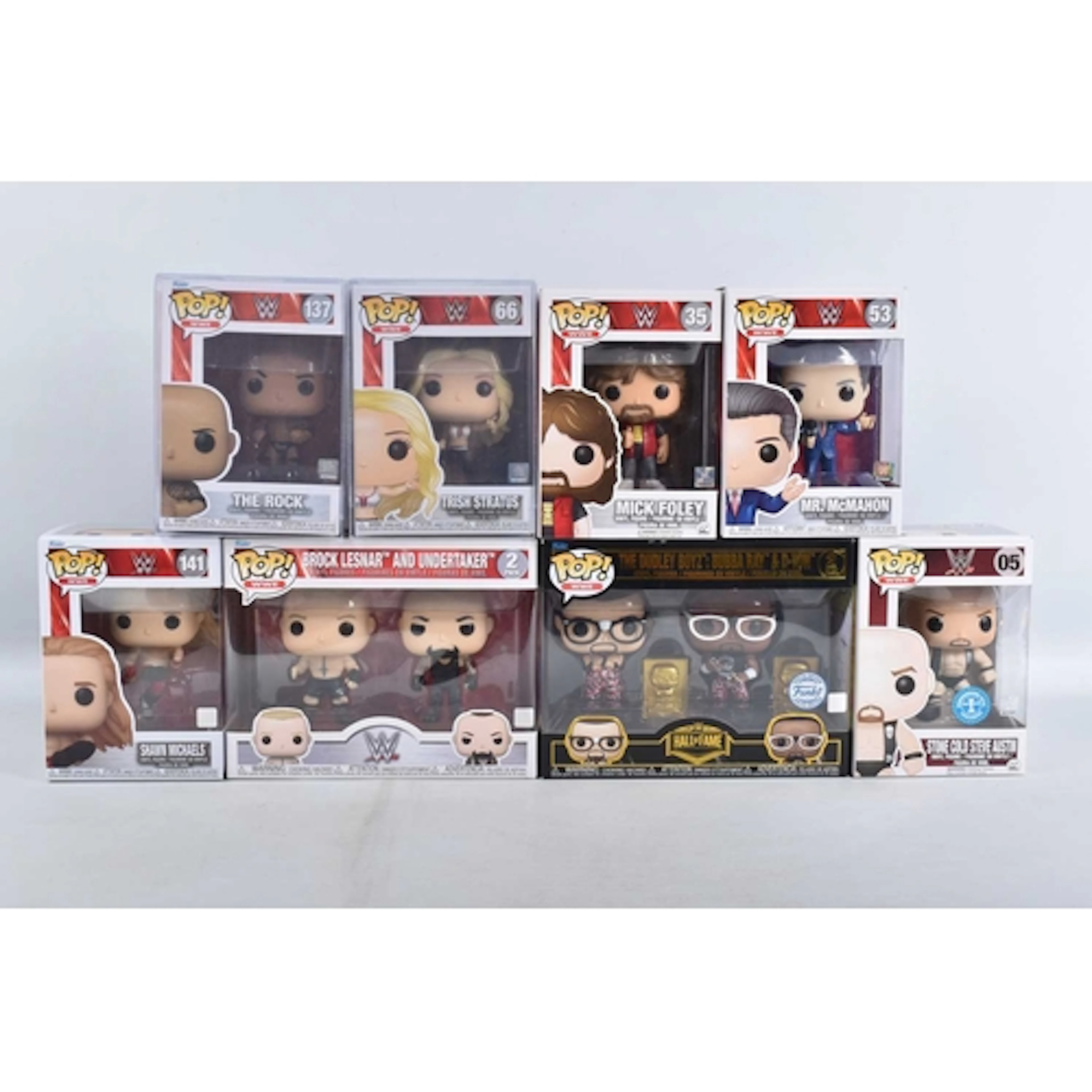 NINE BOXED FUNKO POP! WWE VINYL FIGURES, including a Stone C...