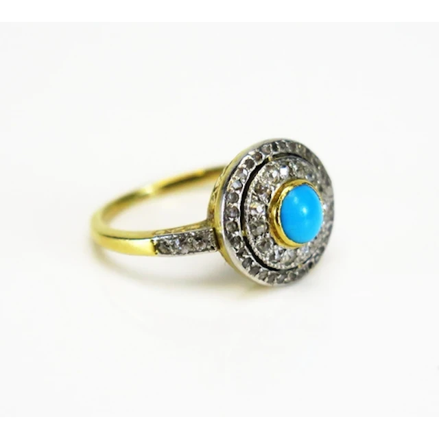 A turquoise and rose cut diamond target ring in a high carat...