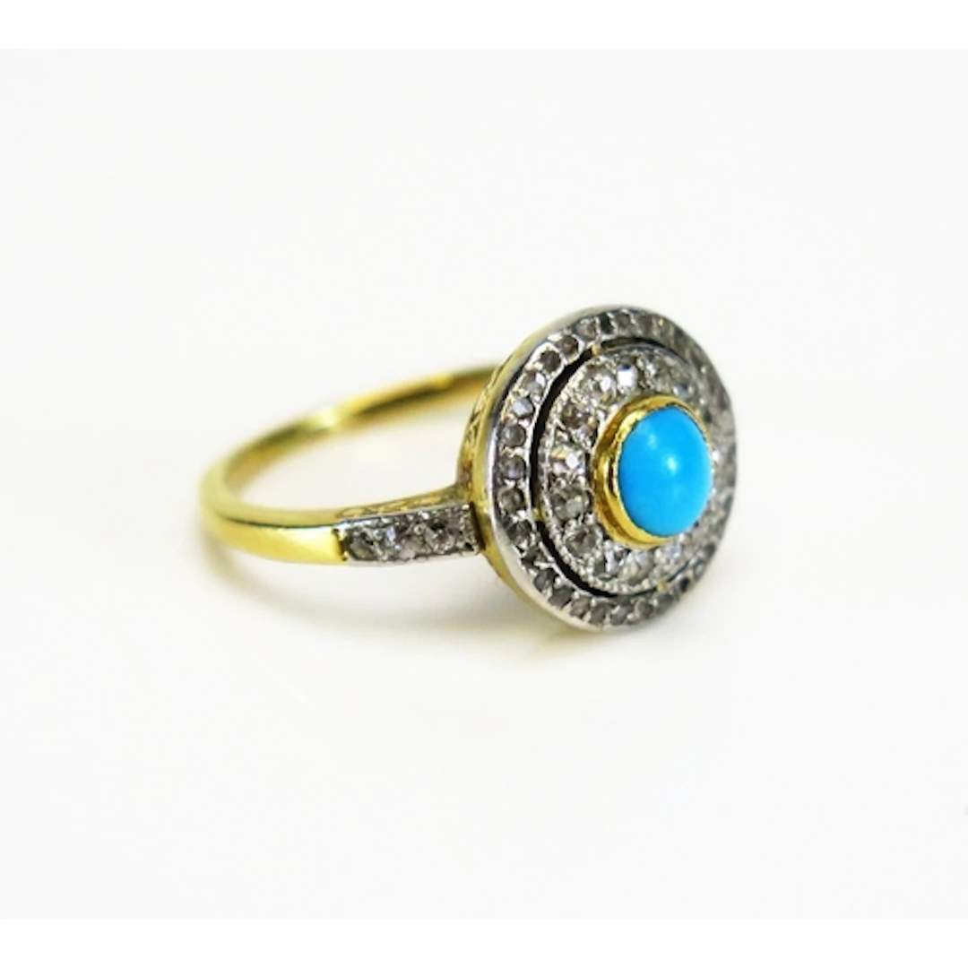A turquoise and rose cut diamond target ring in a high carat...
